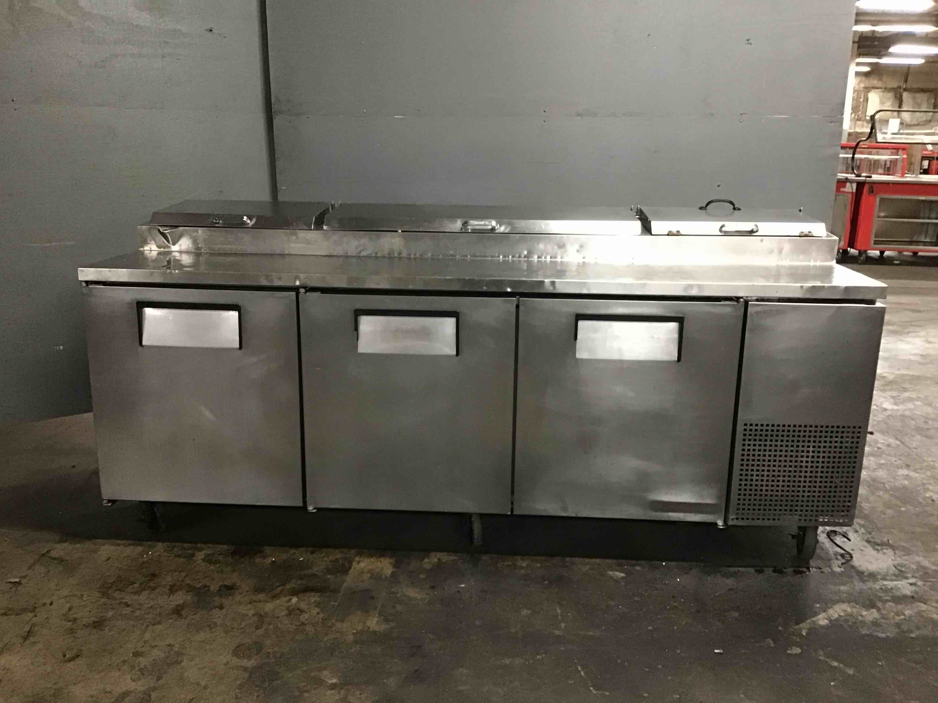 True Stainless Steel 93 Inch TPP-93 3-Door Refrigerated Pizza Prep Table On Casters