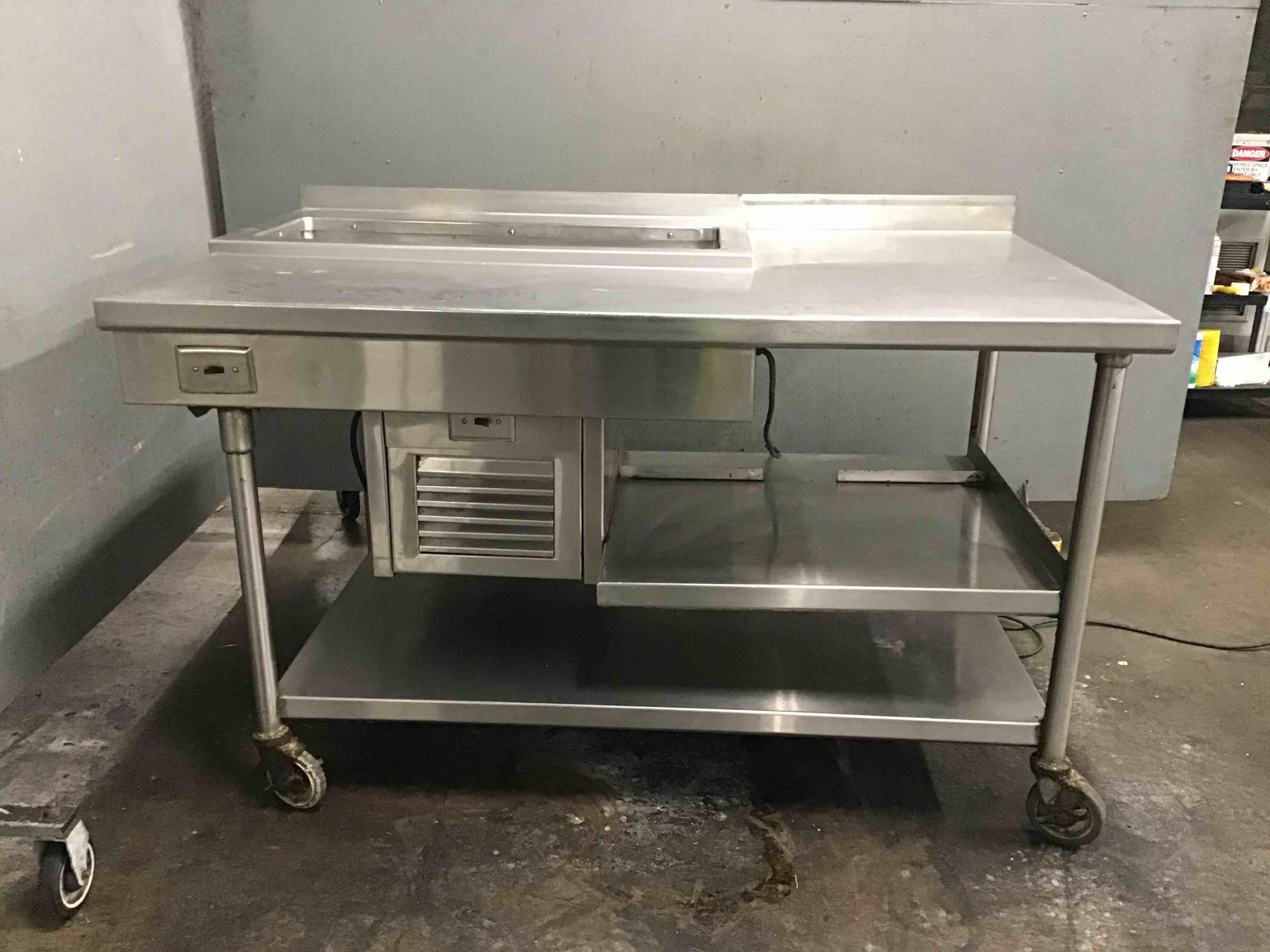 Stainless Steel 61.18 Inch Table With Under Shelves, Electric Heated Left Side Counter, And 34 Inch Cold Pan On Casters