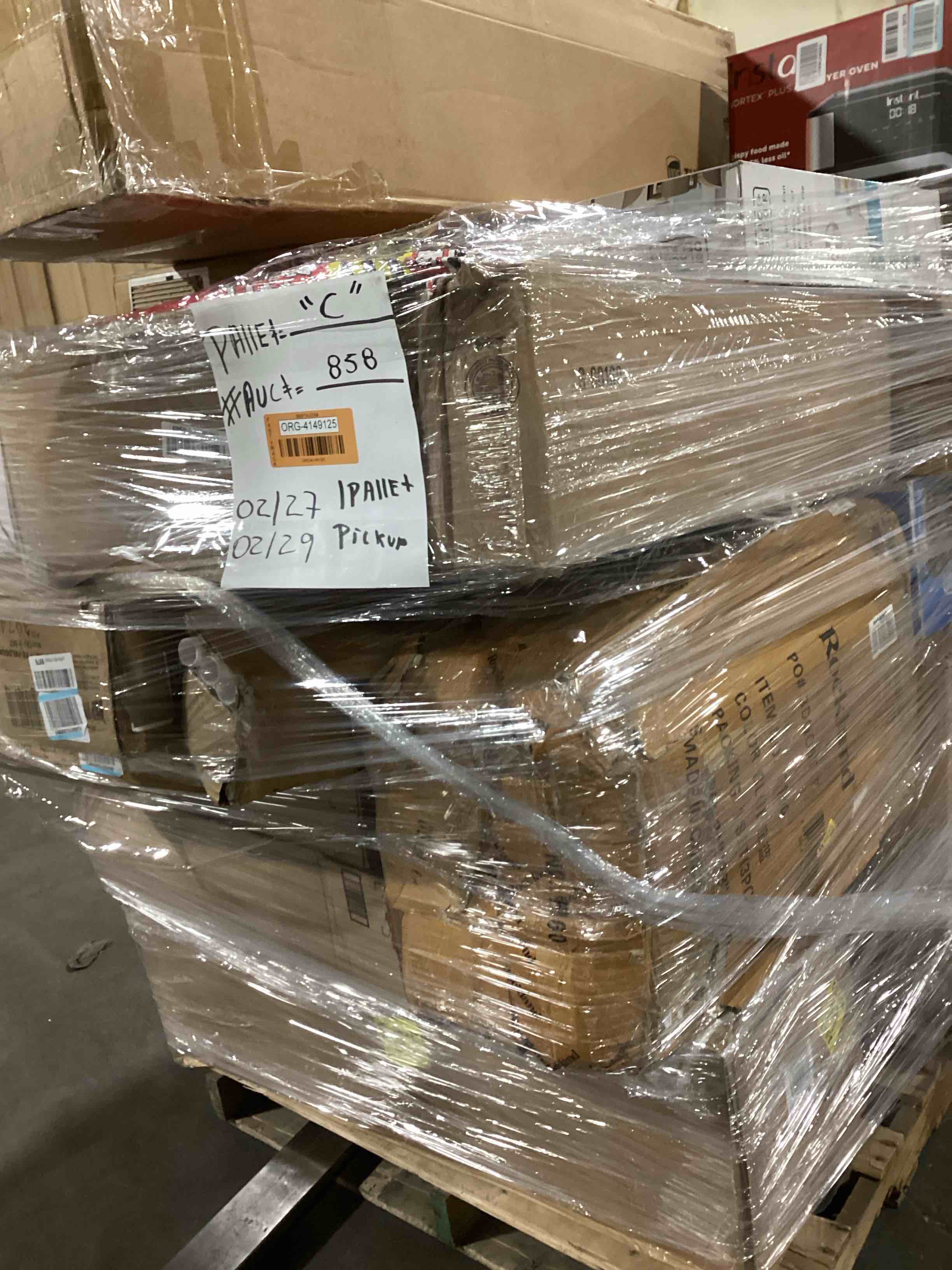 (C) 1 skid pallet items different boxes surprise items or more