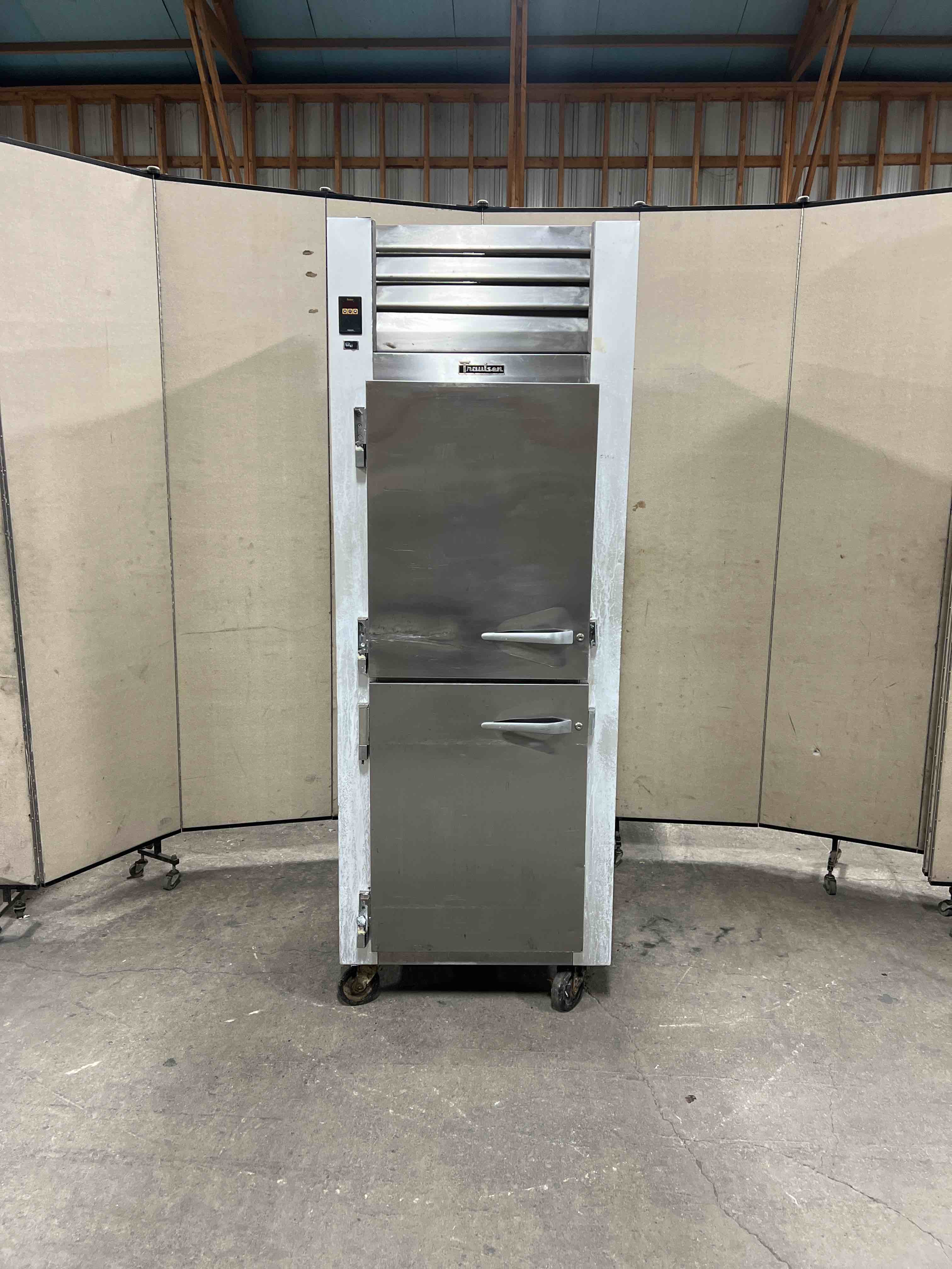 TRAULSEN SINGLE SPLIT DOOR FREEZER ON CASTERS 