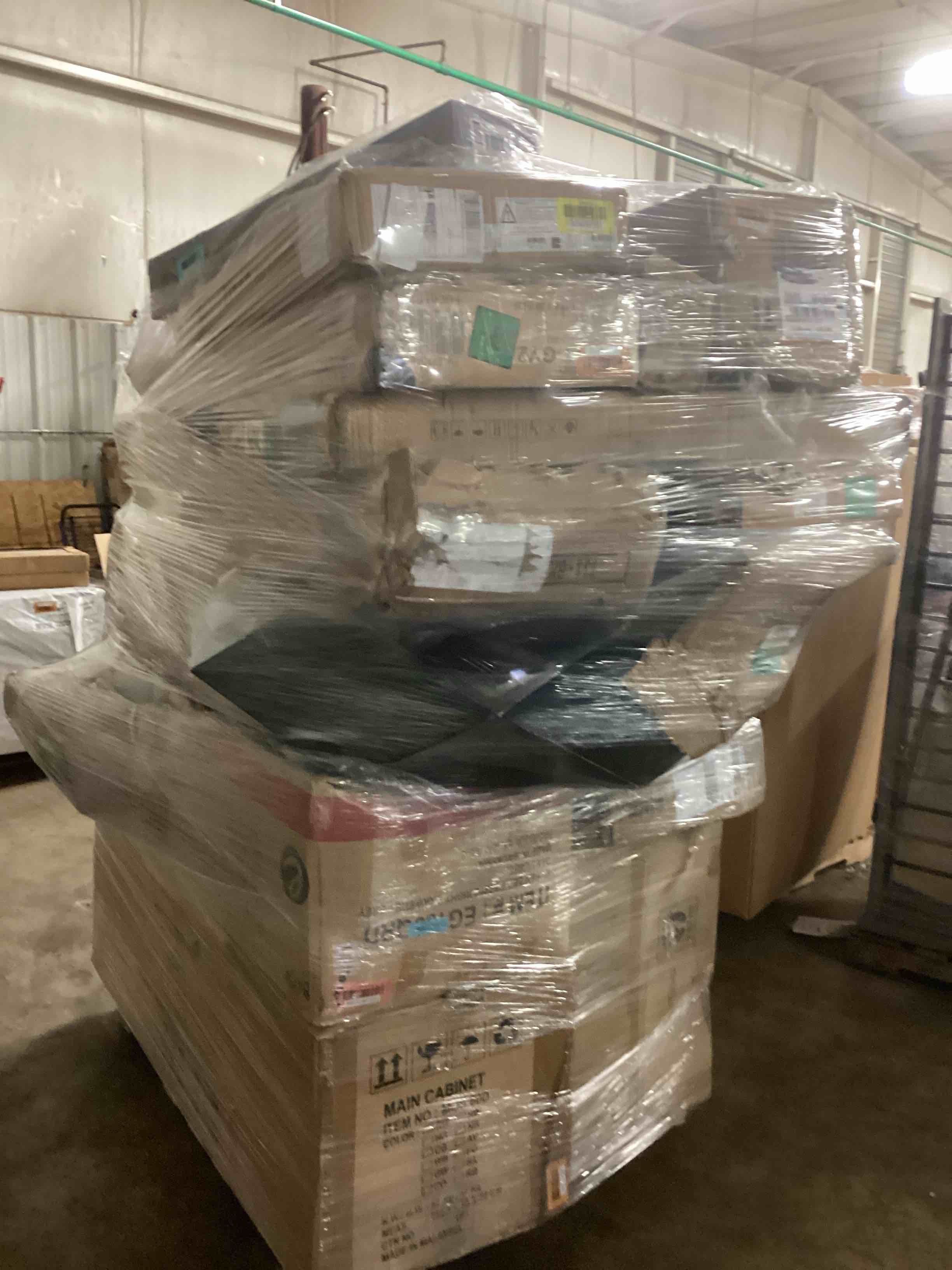 Pallet Lot of Assorted Furniture Components. Cabinet, Bed Components, Coffee Table, and More.