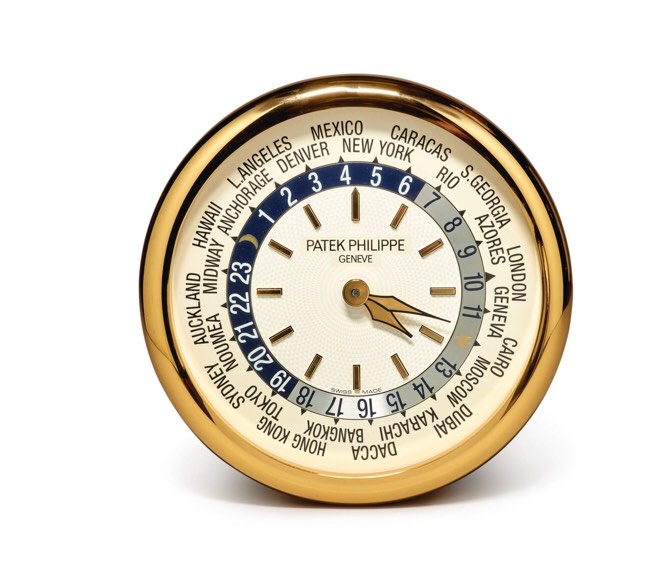 PATEK PHILIPPE/INDUCTA | A LARGE GILT BRASS WALL CLOCK WITH WORLD TIME DIAL, CIRCA 2000