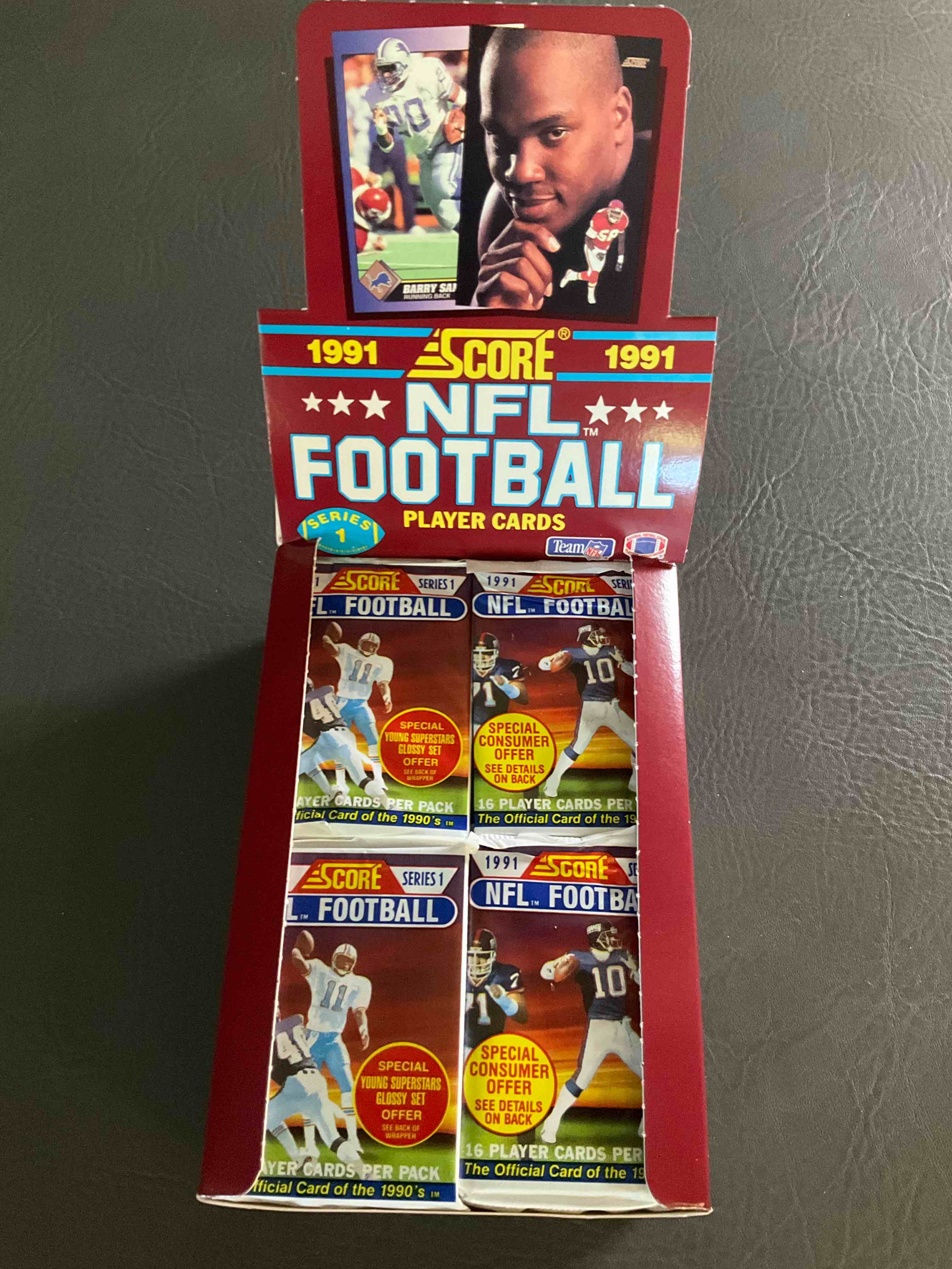 1991 NFL Score Football Sealed Card Pack, Direct From Original Retail Case! These Cards Are Sought After By Collectors For Their Awesome, Nostalgic Look. Search For Brett Favre Rookie, Early Jerry Rice, Early Emmit Smith, Joe Montana & So Much More!