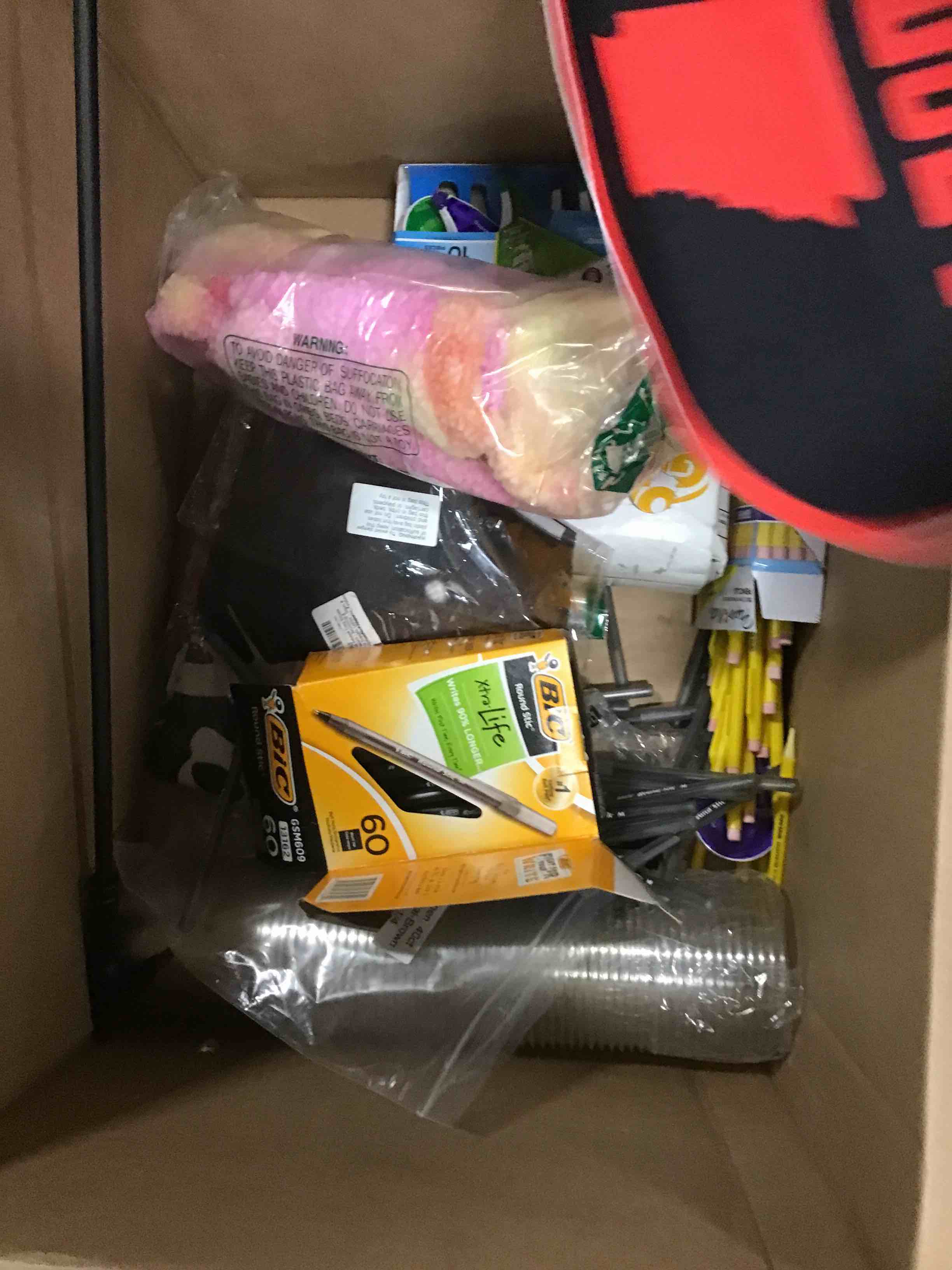 box with assorted office supplies 
