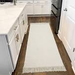 (item is similar)long white area rug with frayed ends