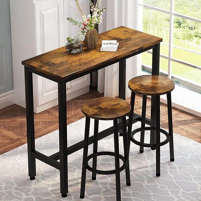 bar table set with two round stools 
