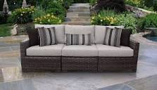 kathy ireland Homes & Gardens River Brook Armless Sofa in Truffle, 2 boxes for pick up 