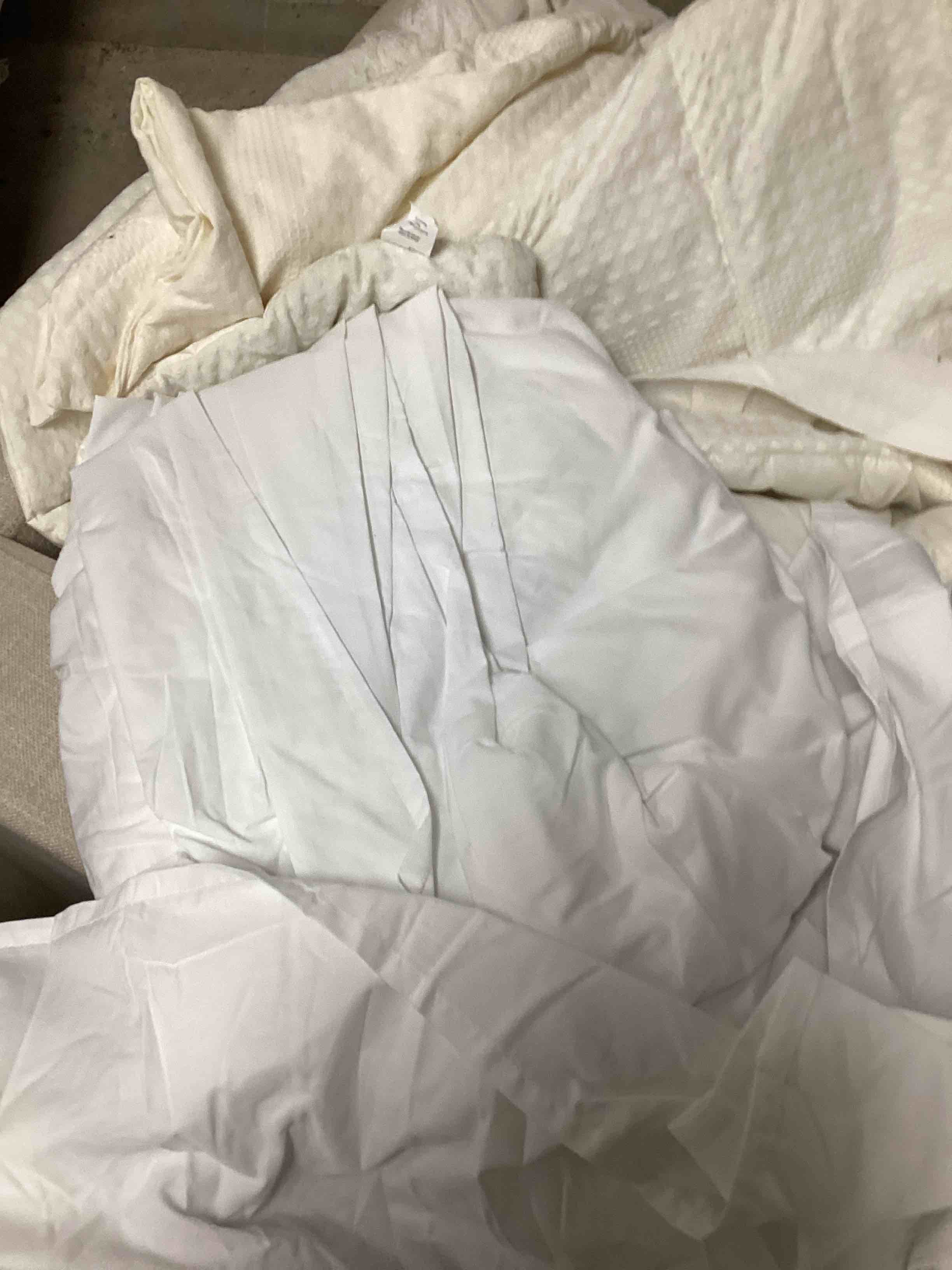 cream colored blanket and white sheet set 
