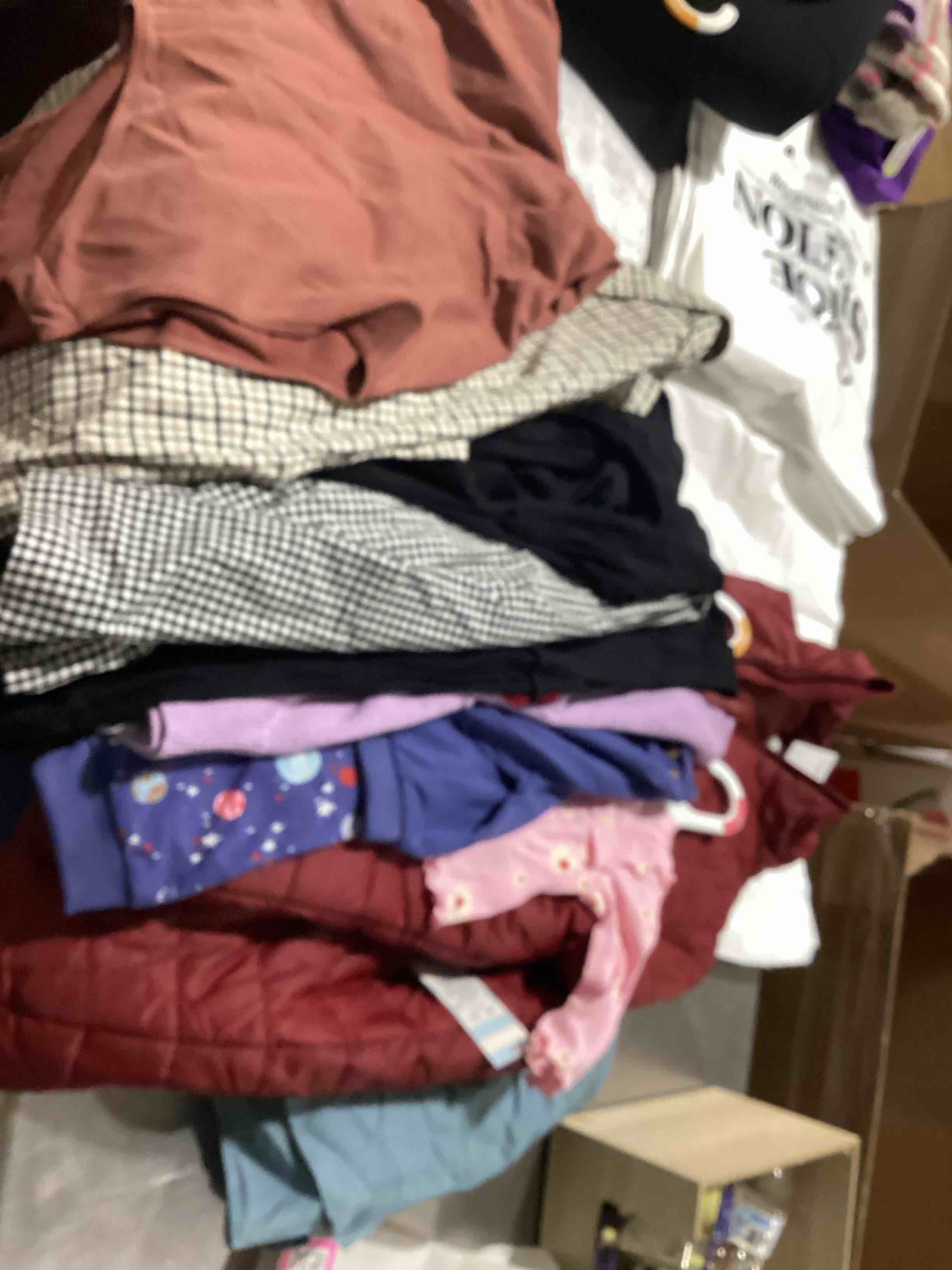 Assorted lot of new clothing all comes in different size and clothes for all the family