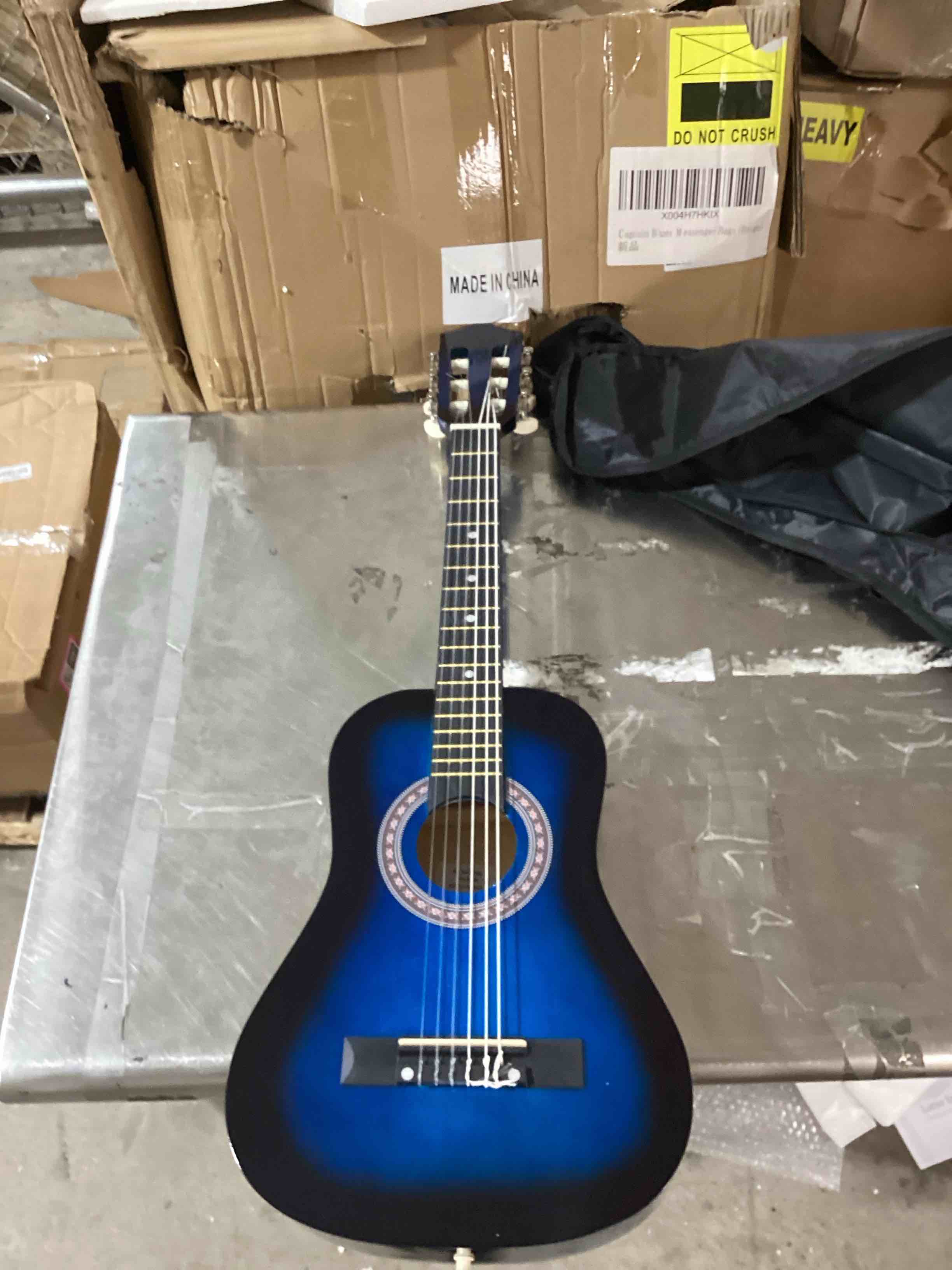 Blue guitar with black holding case