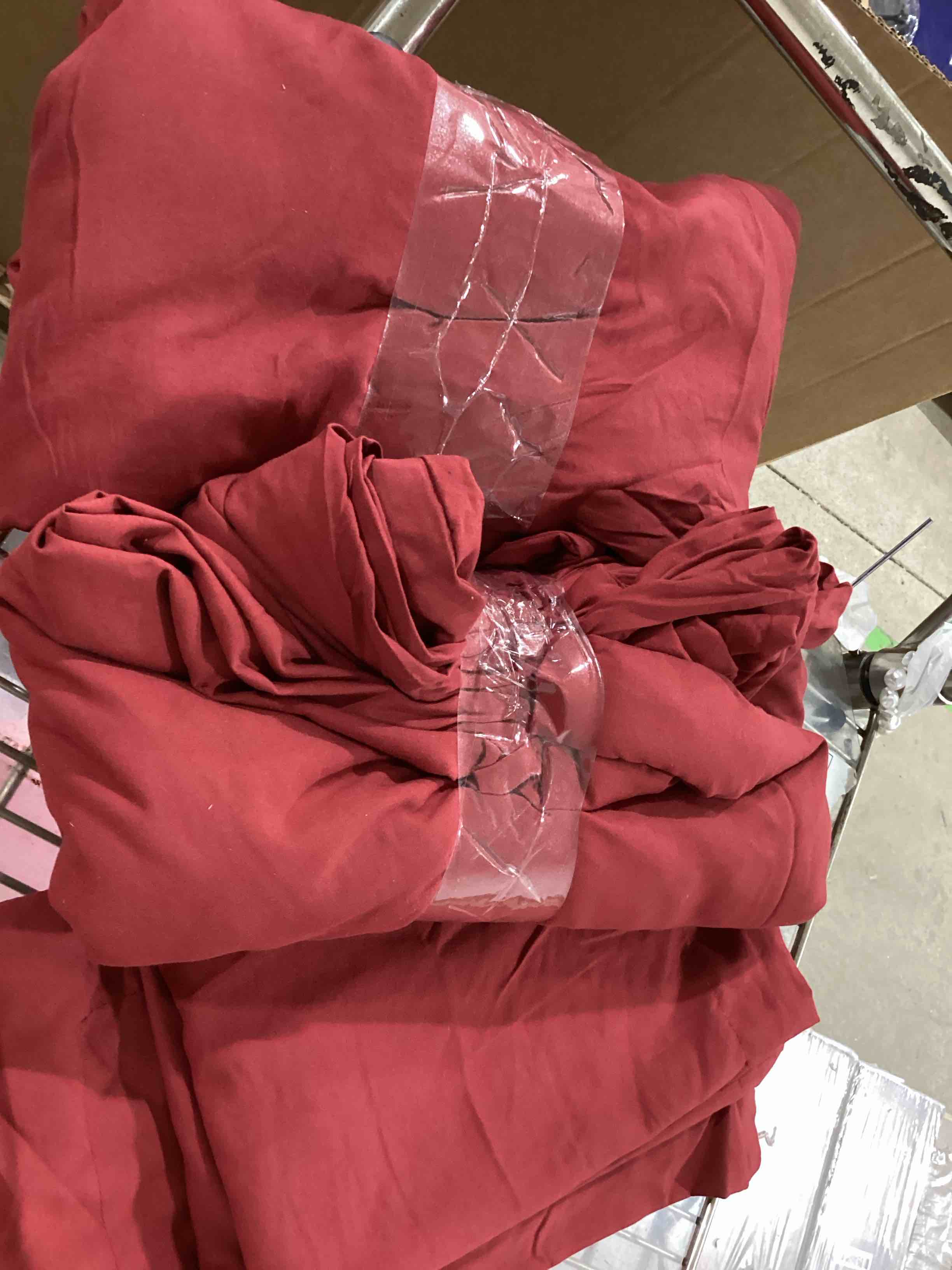 Sheet and wine-colored bed covers