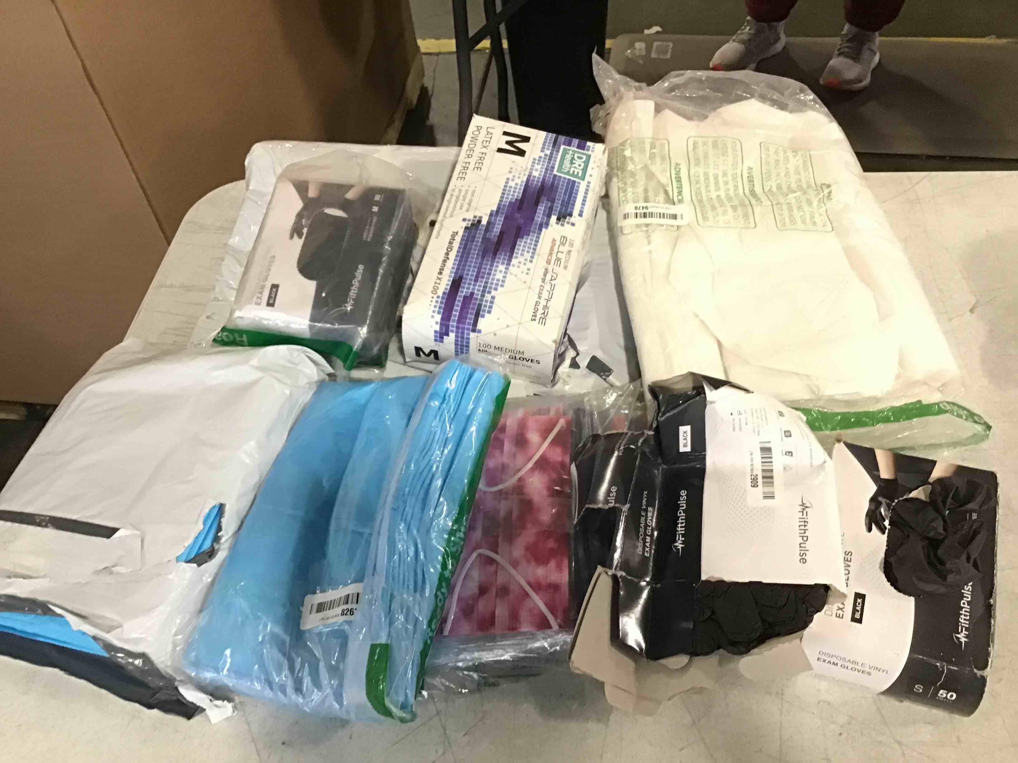 Assorted masks, gloves and medical towels in various styles and sizes