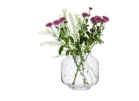 Vase in popular round shape decorated with white butterflies. Perfect backdrop for beautiful flowers Measures 7in x 7.5in 