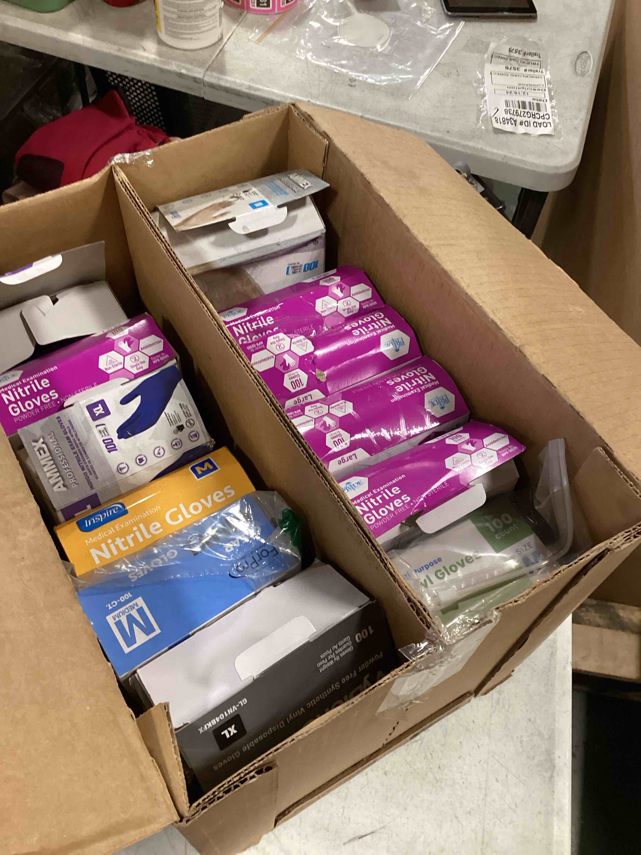 VARIETY OF DIFFERENT SIZES AND COLORS OF RUBBER GLOVES 