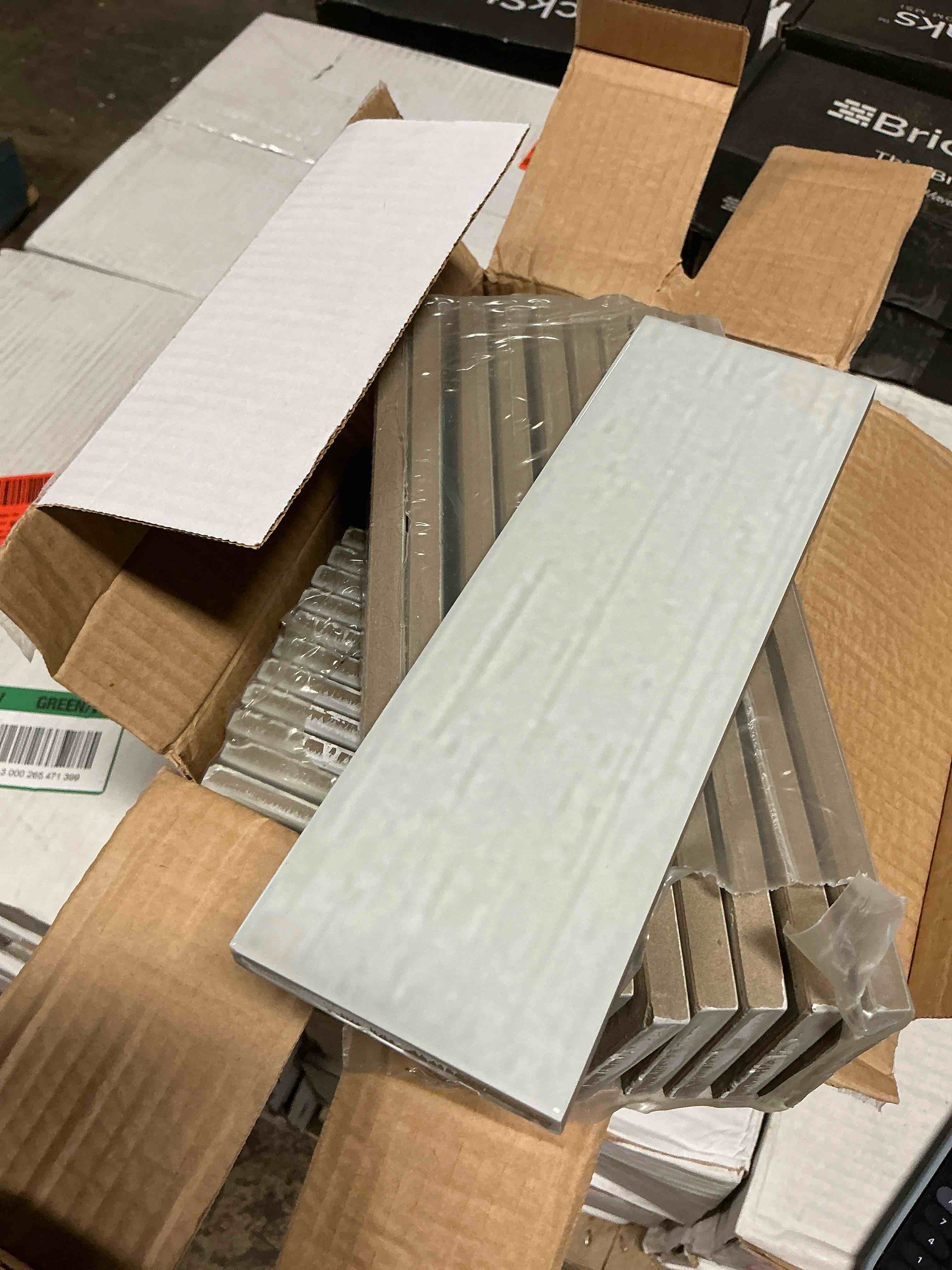37.6 sq ft kiln porcelain 3” x 9” silver gloss tile your bid per sq ft 