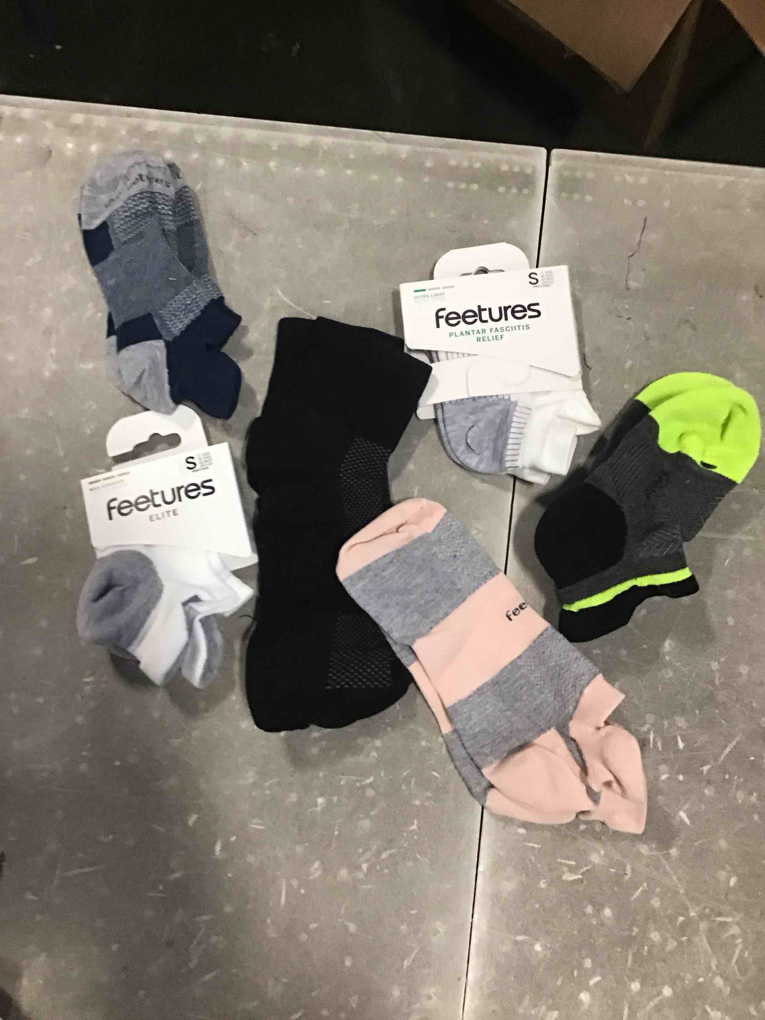 assorted lot of various types and different color socks ((all different sizes and colors))
