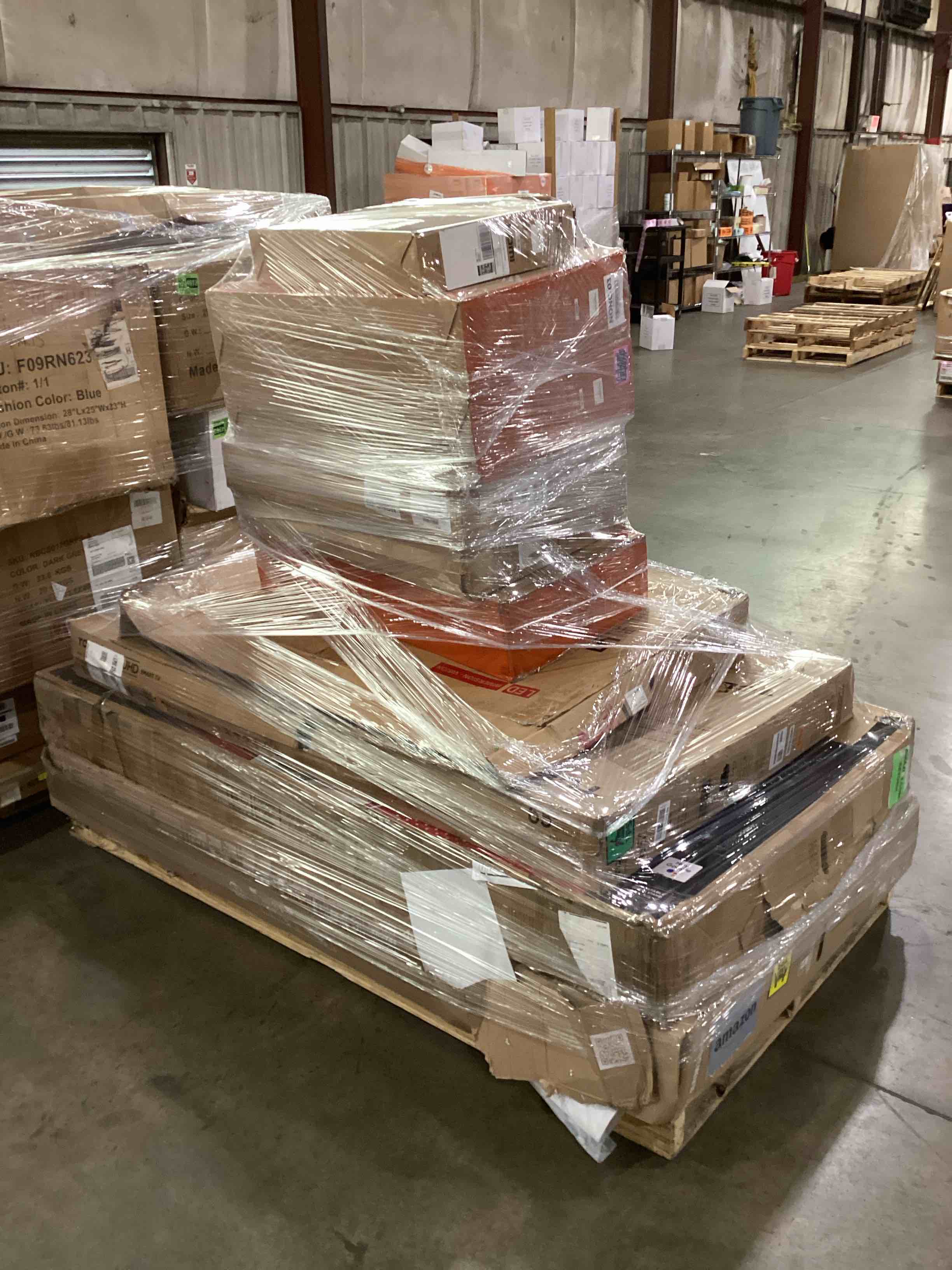 pallet of broken tv’s and monitors