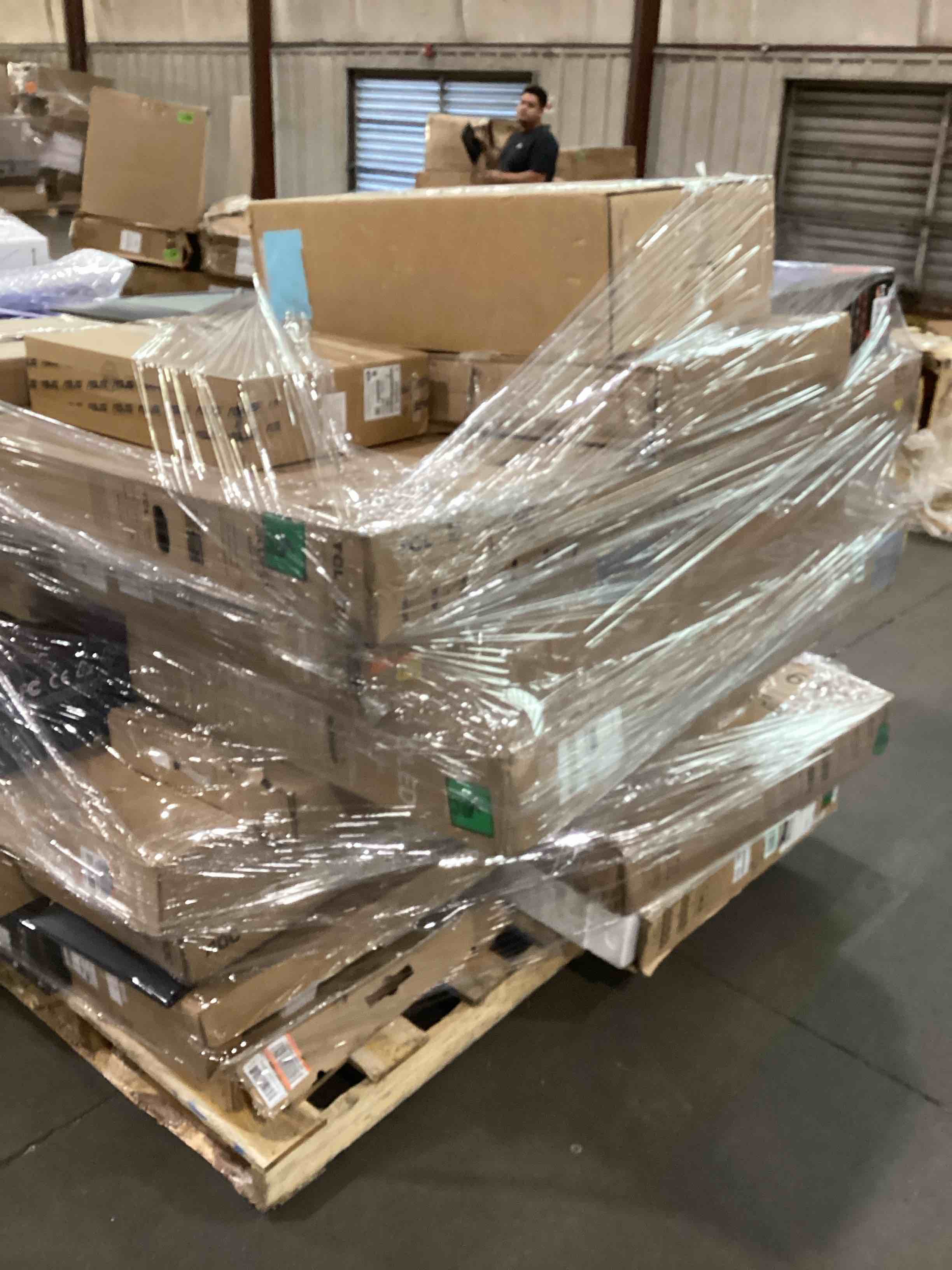 pallet of broken tv/monitors 