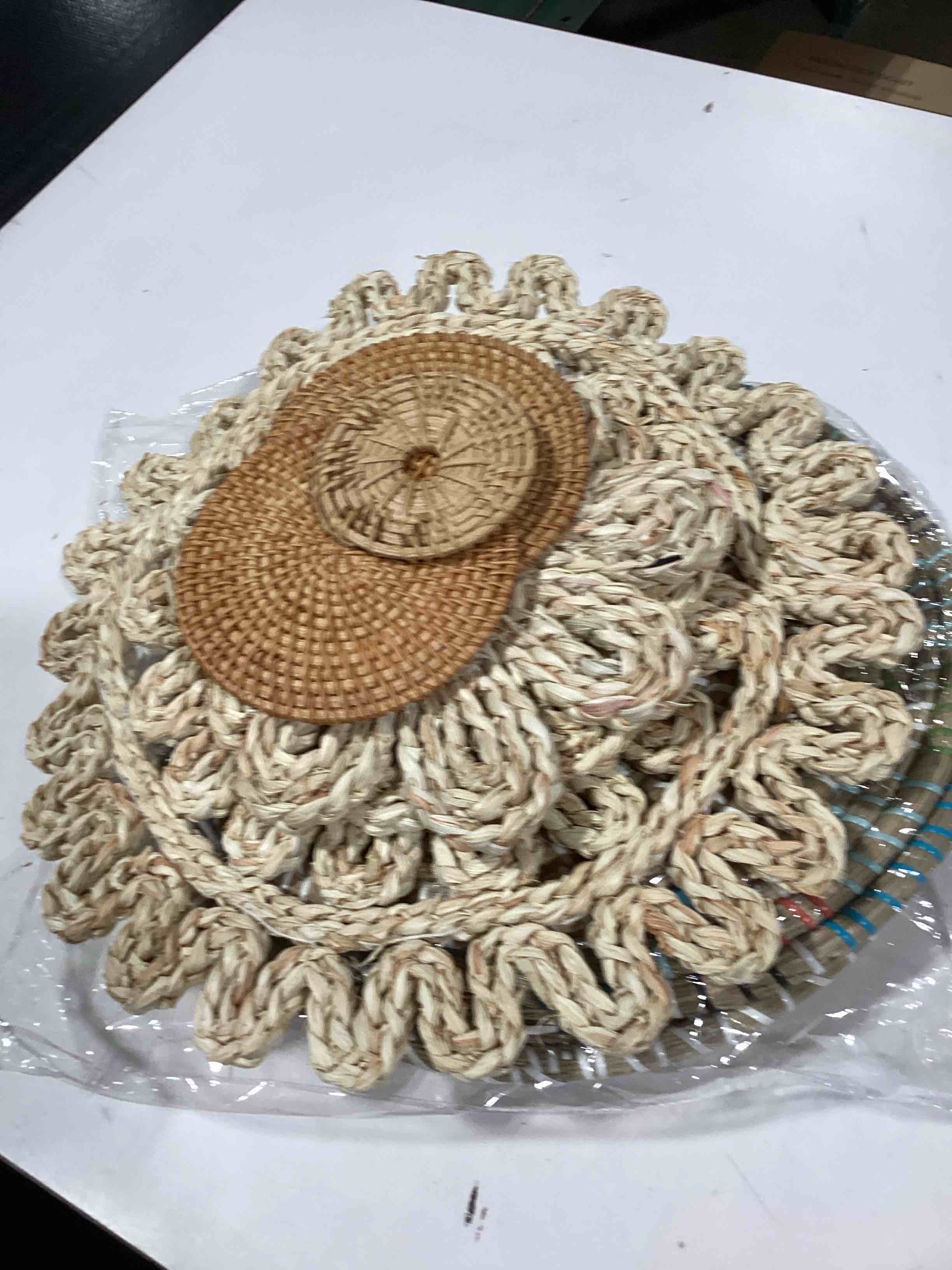 various woven placemats and coaster