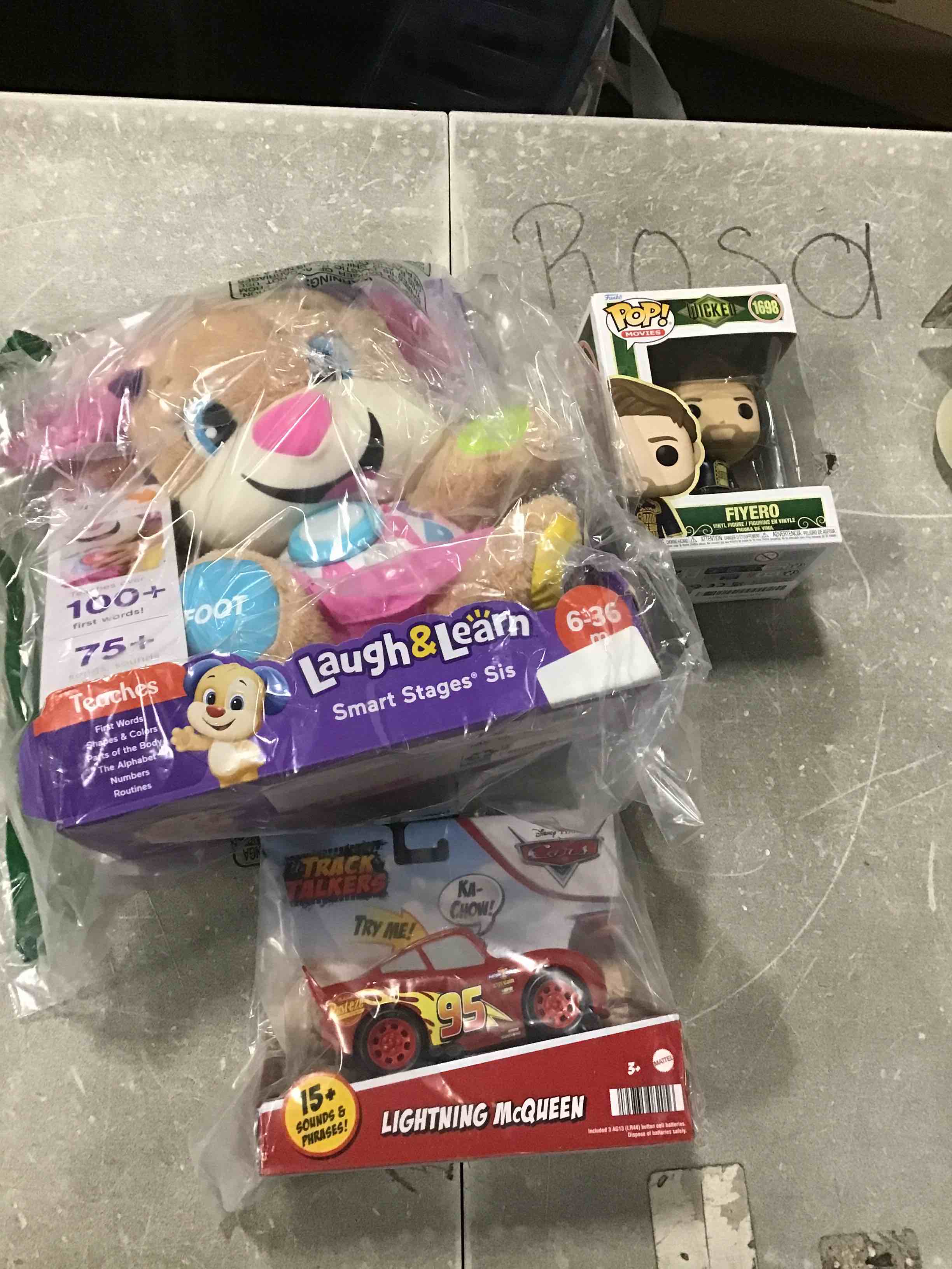 Assorted children’s toys of different ages. Includes Funks POP. Movies WICKED 1968 FIYERO, Laugh & Learnn Smart Stages Teaches, Track Talkers Lightning MC Queen