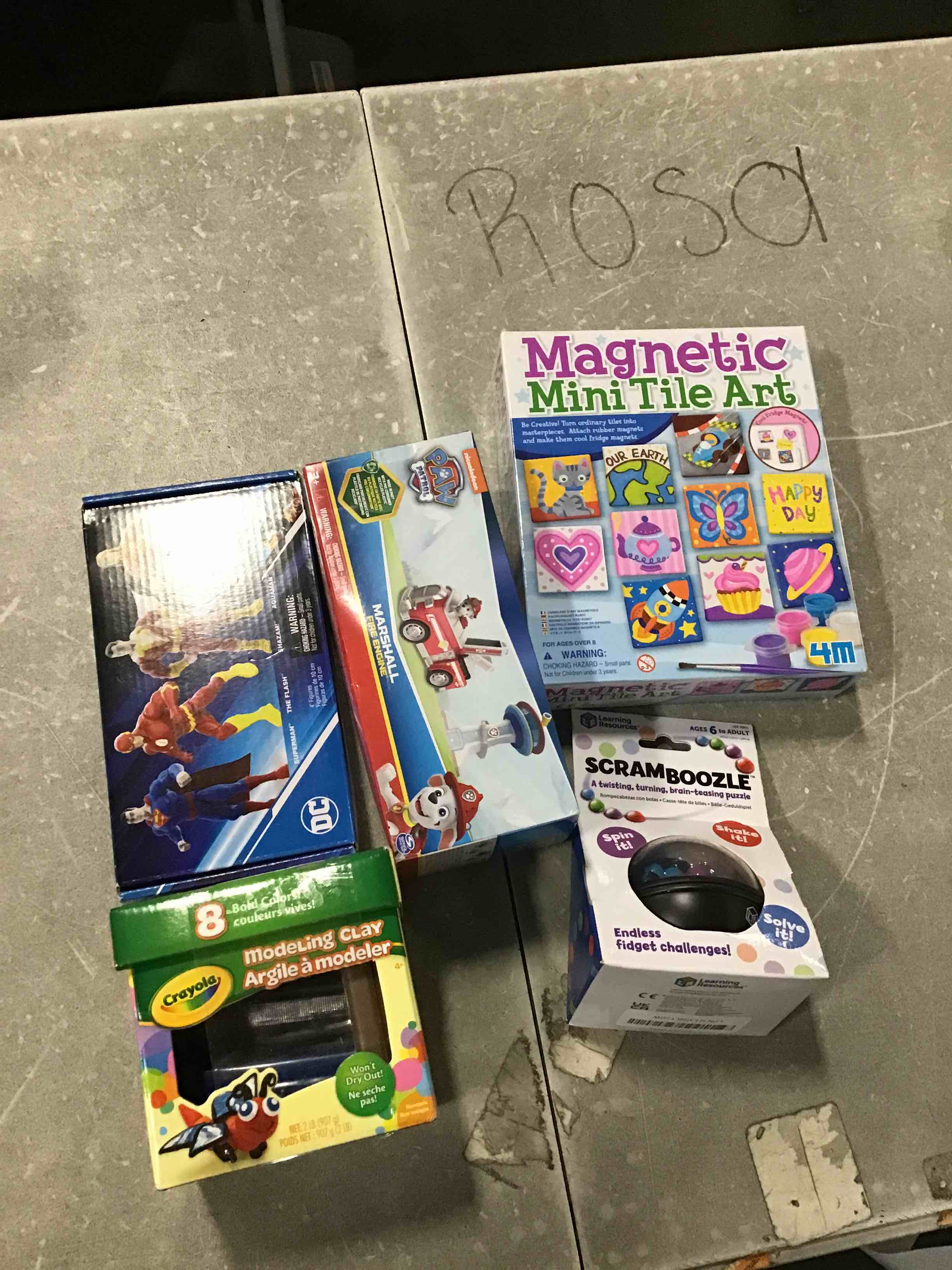 Assorted Children’s Toys of Different Ages Incllle, Magnetic Mini Tile Art, ScramBoozle, Paw Patrol Marshall Fire Engine, Rawlings Golf Balls Crayola Modeling Clay Argeile a Modeler