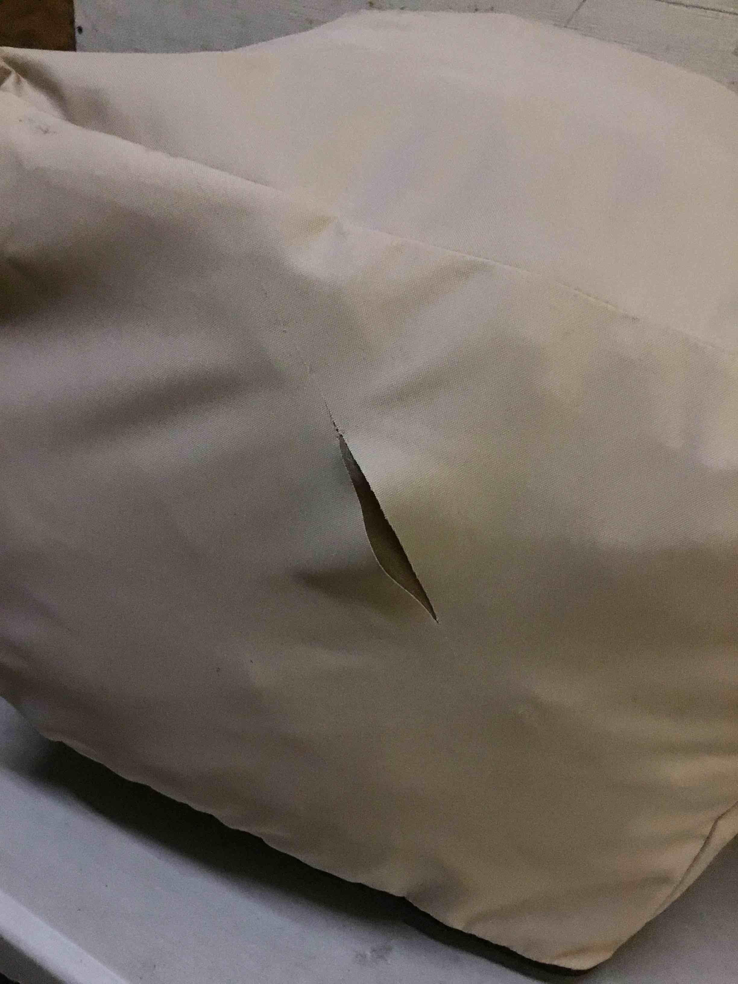 Condition photo showing As Is for ( with rips ) outdoor patio bean bag ottoman - small beanbag foot rest