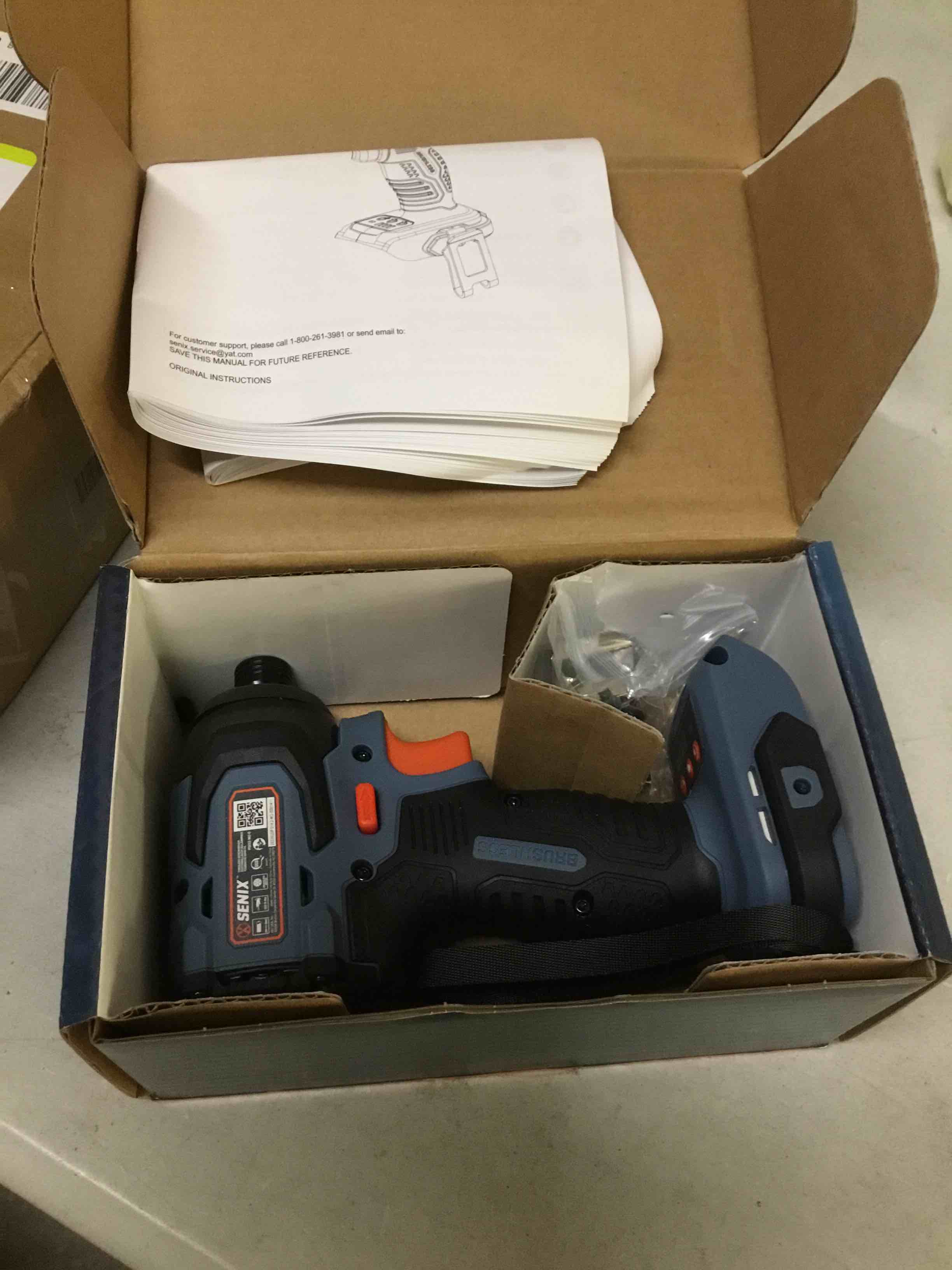 Condition photo showing As Is for ( incomplete) senix 20 volt max* 1/4-inch impact driver, brushless motor, 130 foot-pound of max torque, 3000 rpm (battery, charger and soft bag included) pdix2-m2