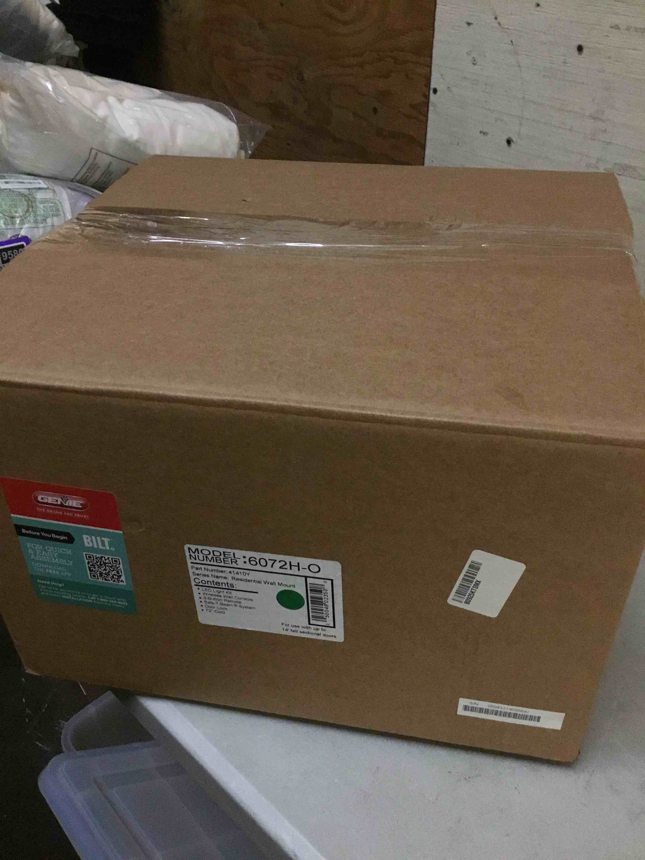 Condition photo showing As Is for ( with crack) genie b6172h wall mount smart garage door opener, dc motor lifts up to 14ft high 850lbs, black