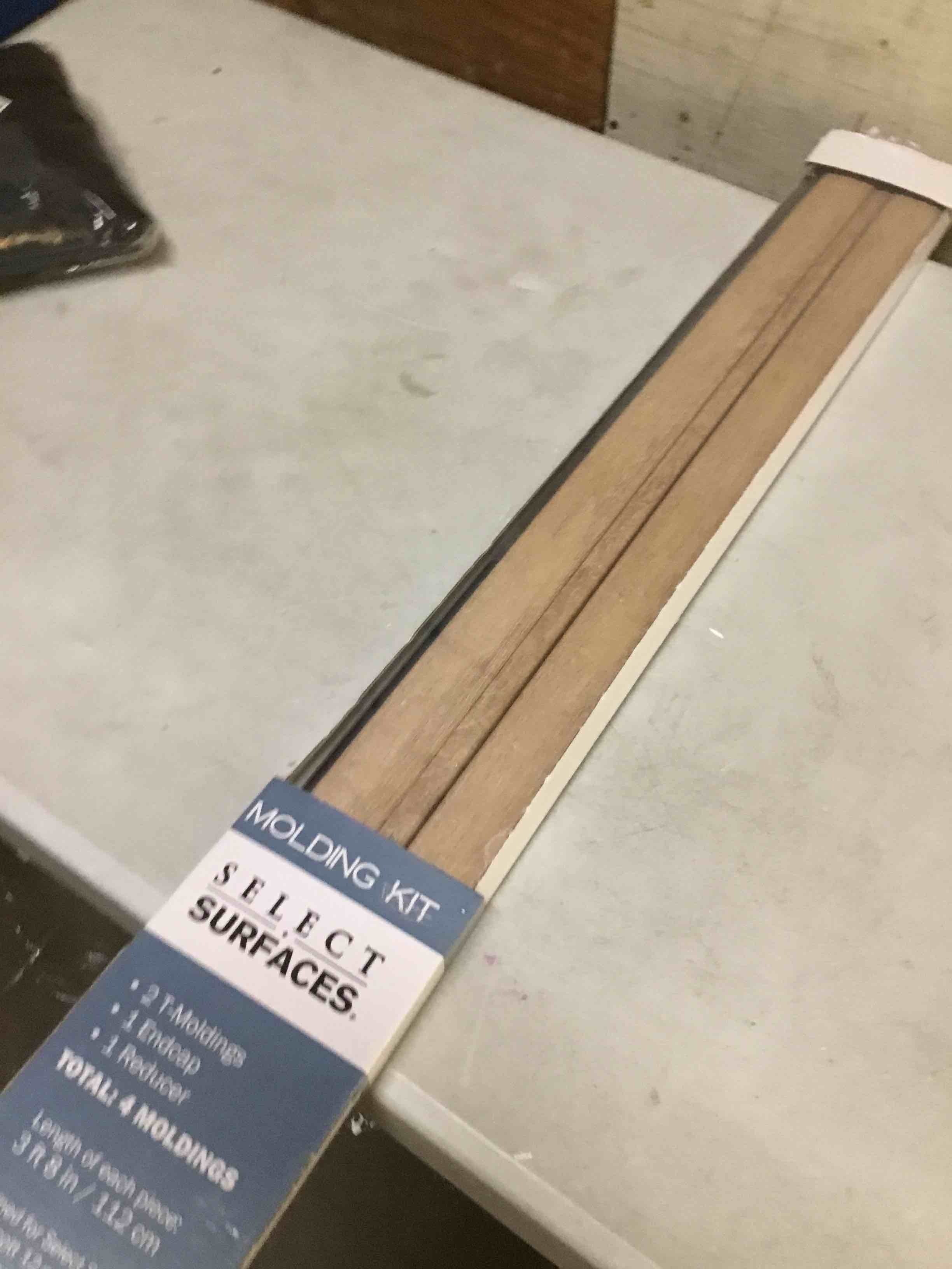 Condition photo showing As Is for select surfaces 3ft x 8 in. laminate flooring molding kit - brown
