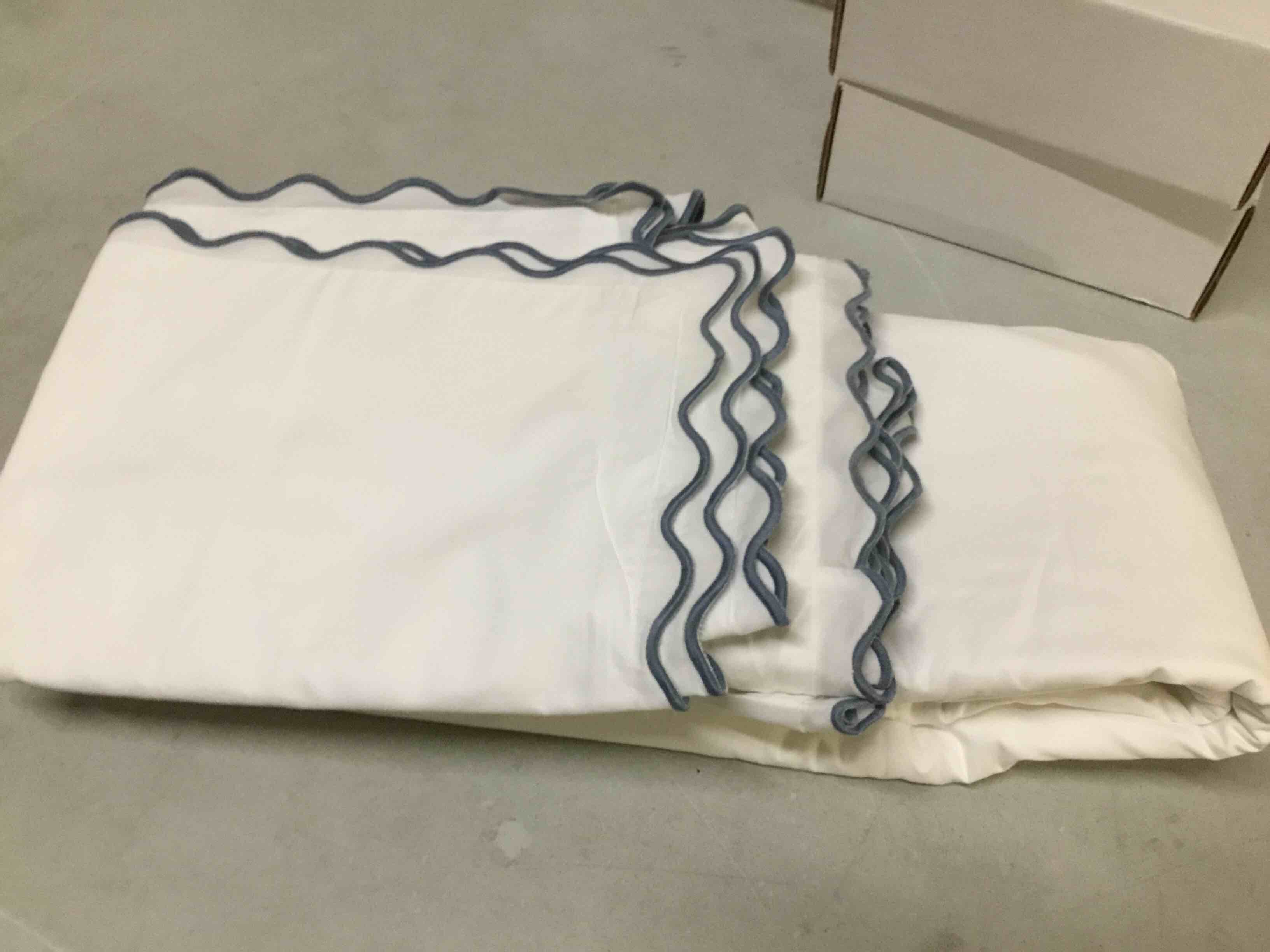 Condition photo showing As Is for ( incomplete) organic crisp quince percale deluxe bedding bundle in mineral scallop size/king