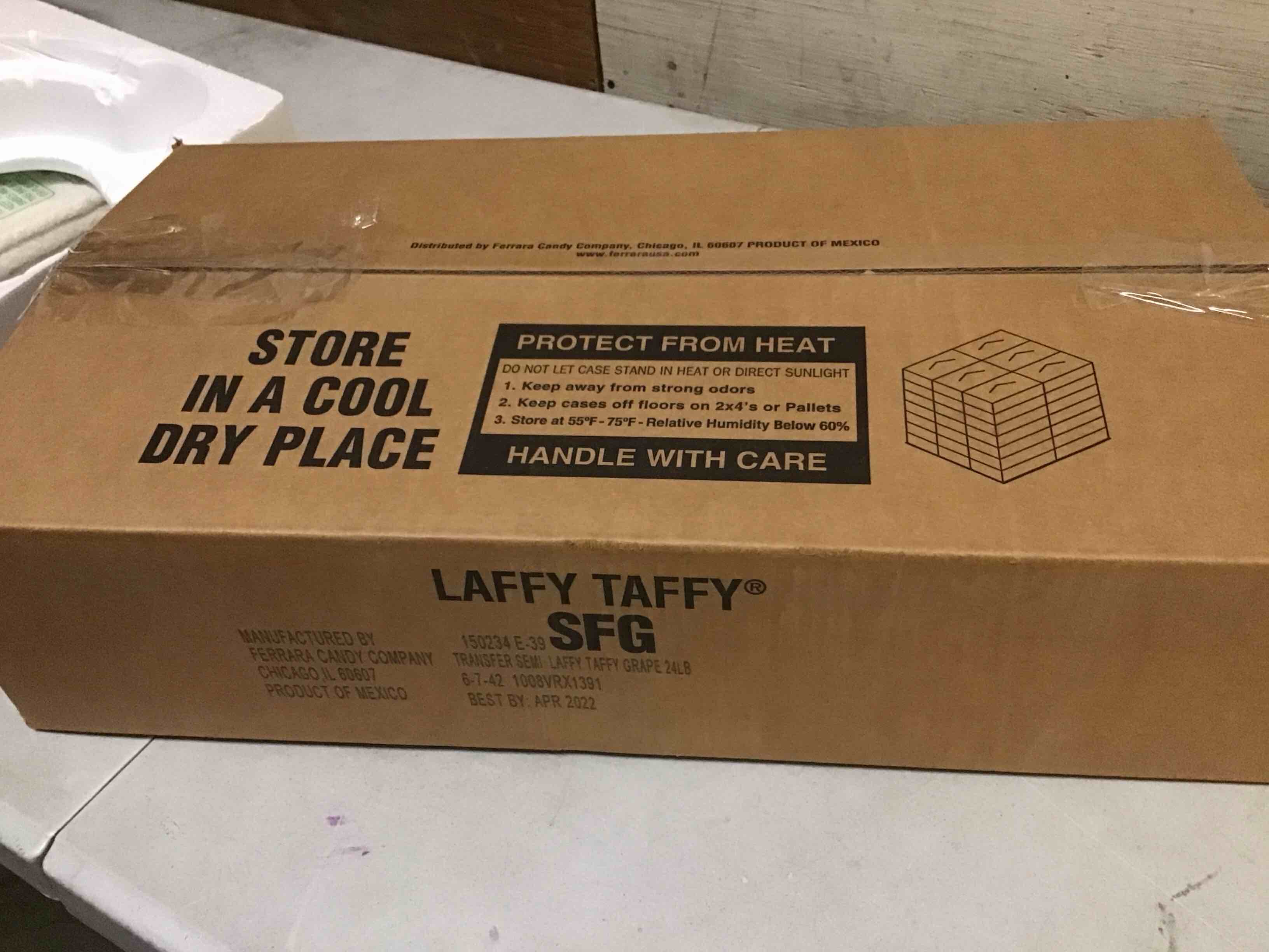 Condition photo showing Good Condition for ( best by april 2022) laffy taffy grape flavors 24lb