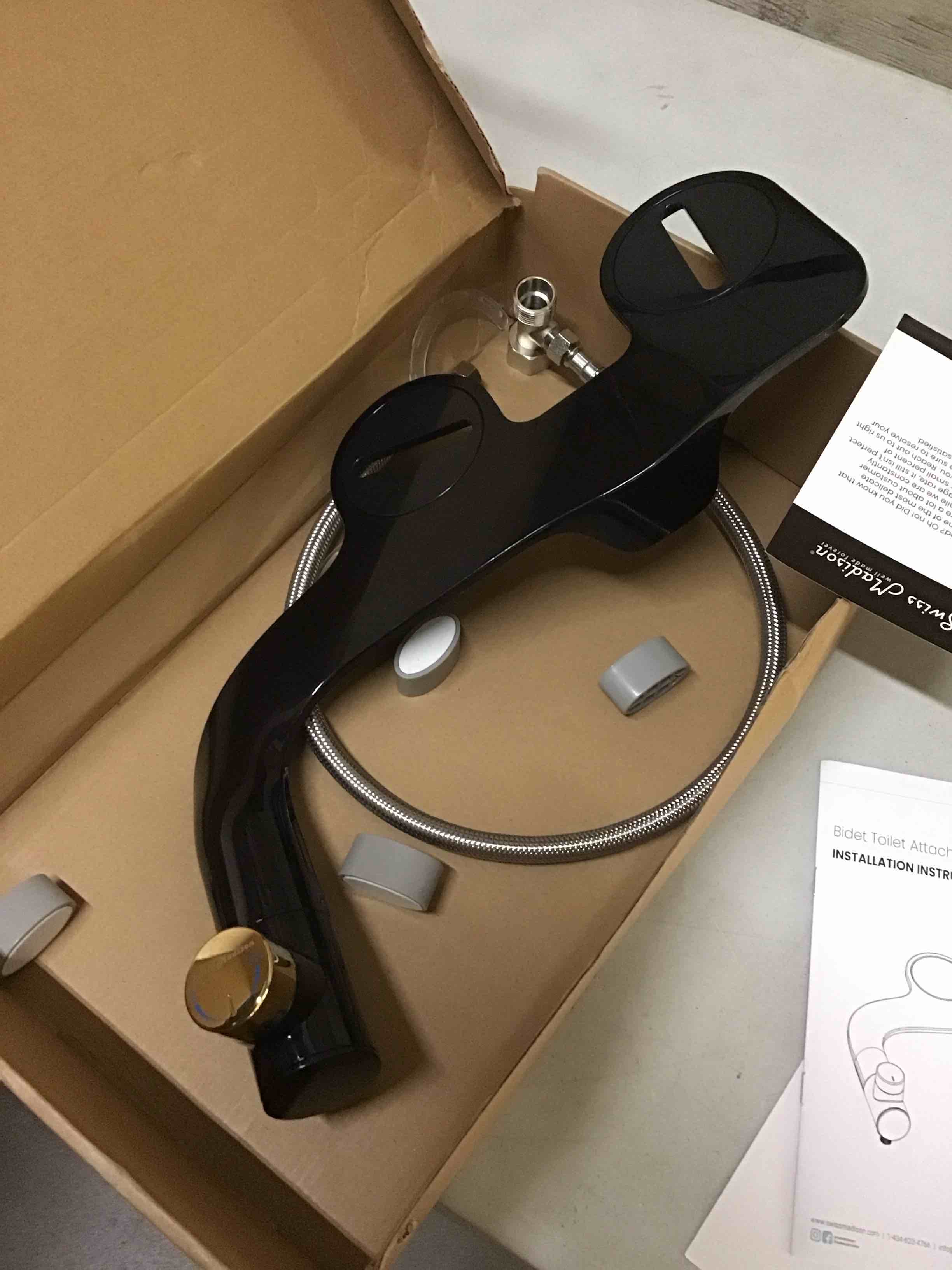 Condition photo showing As Is for swiss madison aqua non-electric bidet toilet attachment in glossy black with black knob - amazon.com