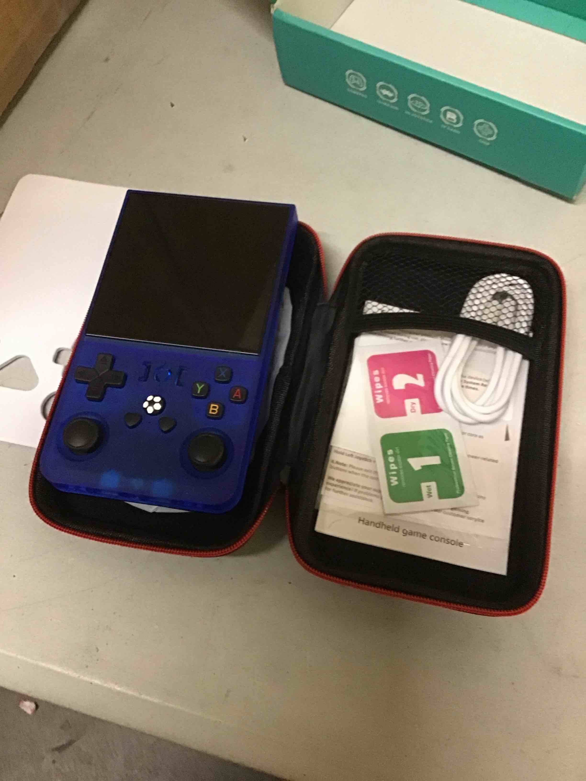 Condition photo showing As Is for r36max retro gaming console, 4.0 inch handheld game console with 64gb classic video games inchluded,support 30+ simulators,hand held game console for christmas-transparent blue blue-64gb