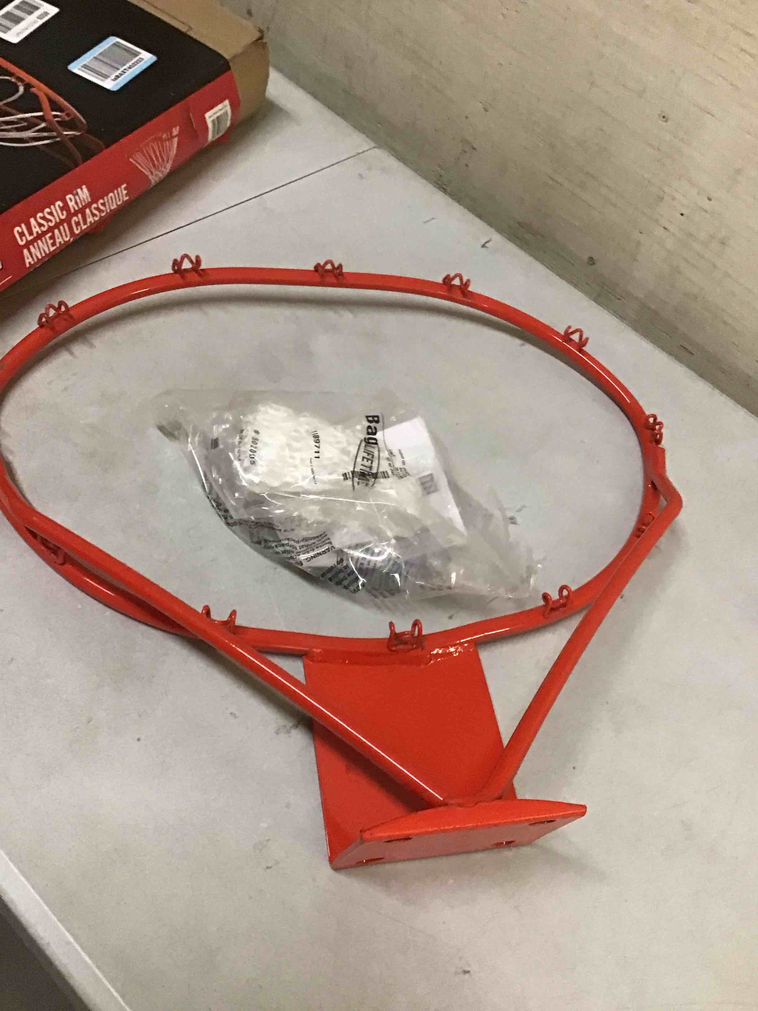 Condition photo showing As Is for ( bent ) lifetime 5818 classic basketball rim, orange