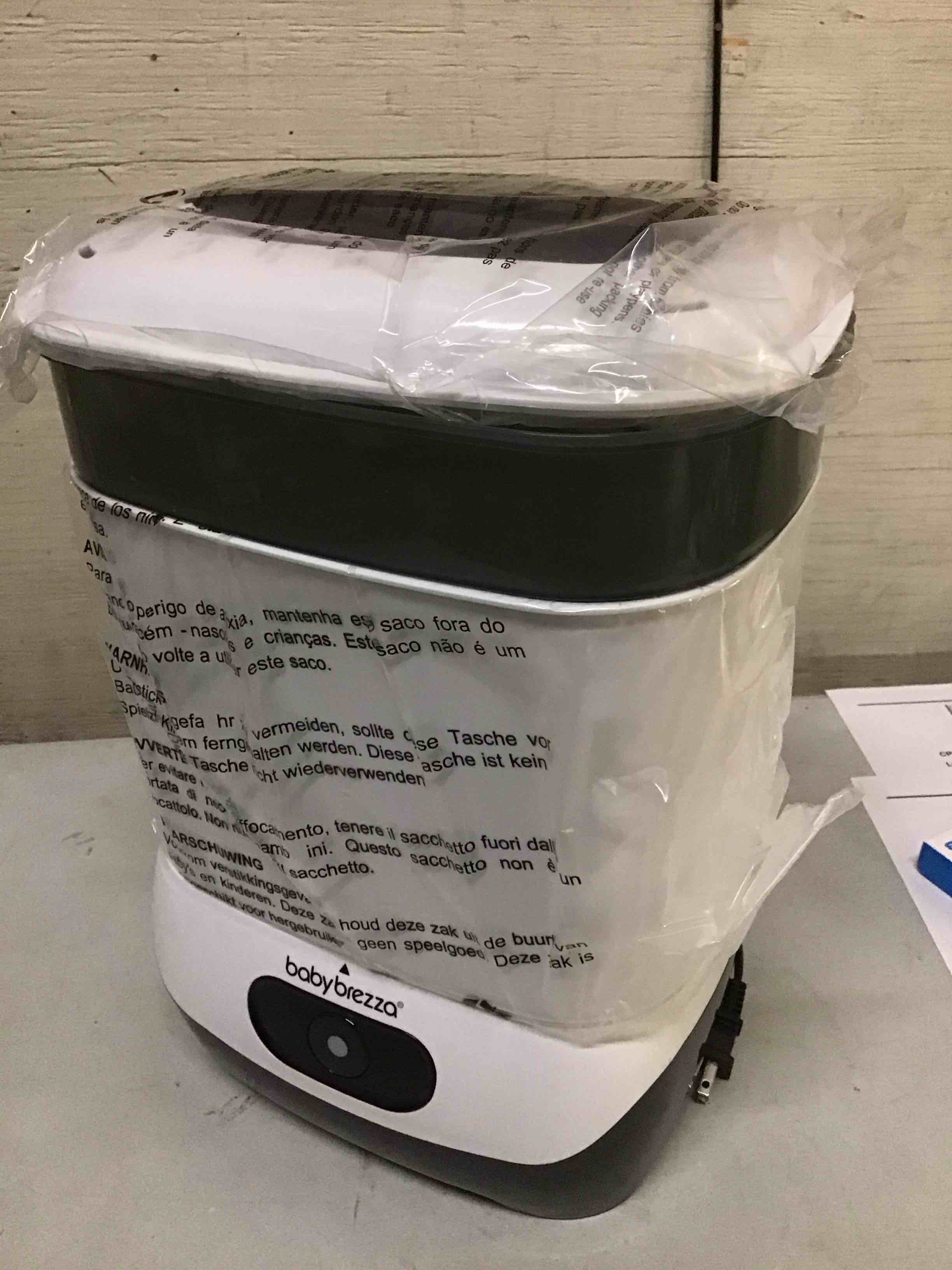 Condition photo showing As Is for baby brezza 4 in 1 baby bottle sterilizer machine – largest capacity electric steam sterilization – pacifiers, breast pump parts + universal sterilizing for all bottles: plastic, glass, large, small sterilizer without dryer