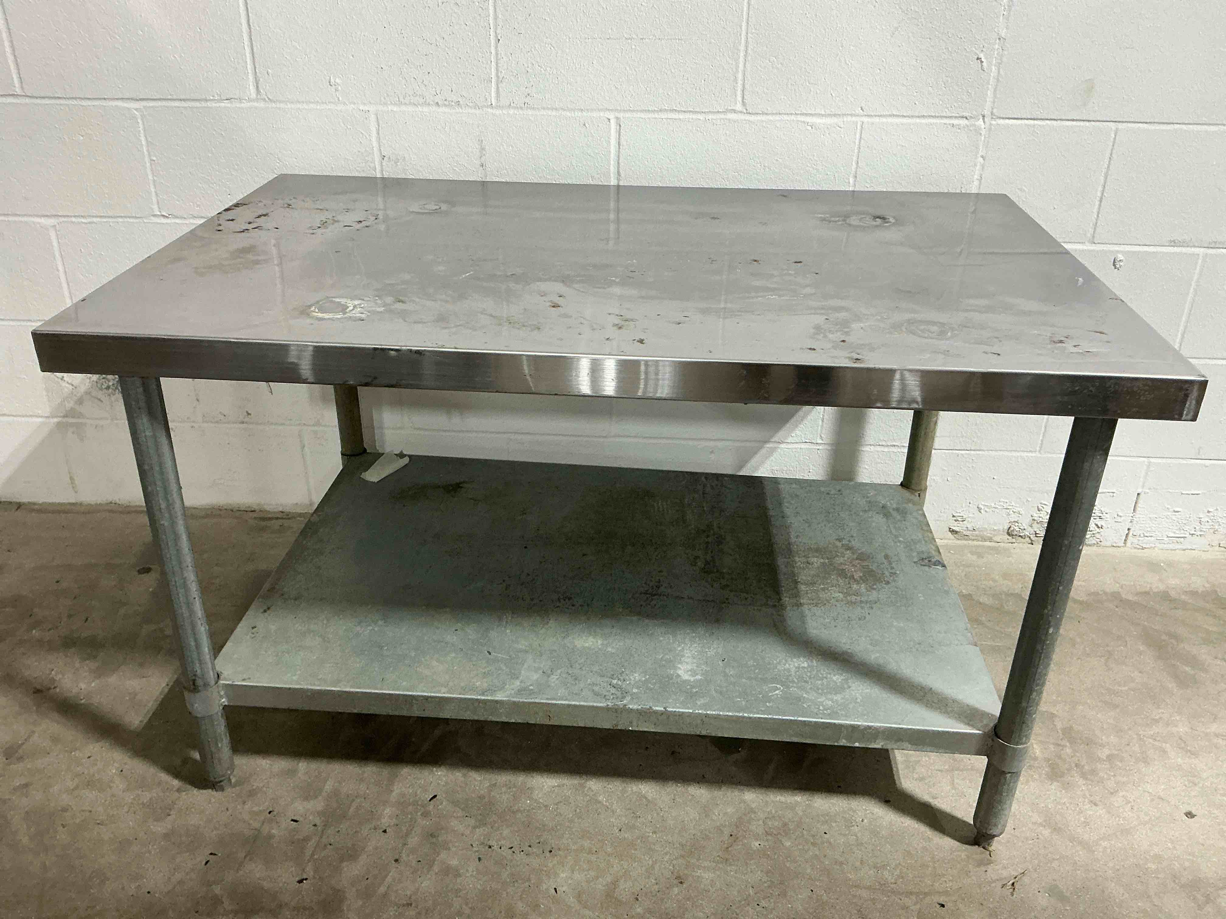 Condition photo showing As Is for sani safe 30” x 48” stainless steel prep table 