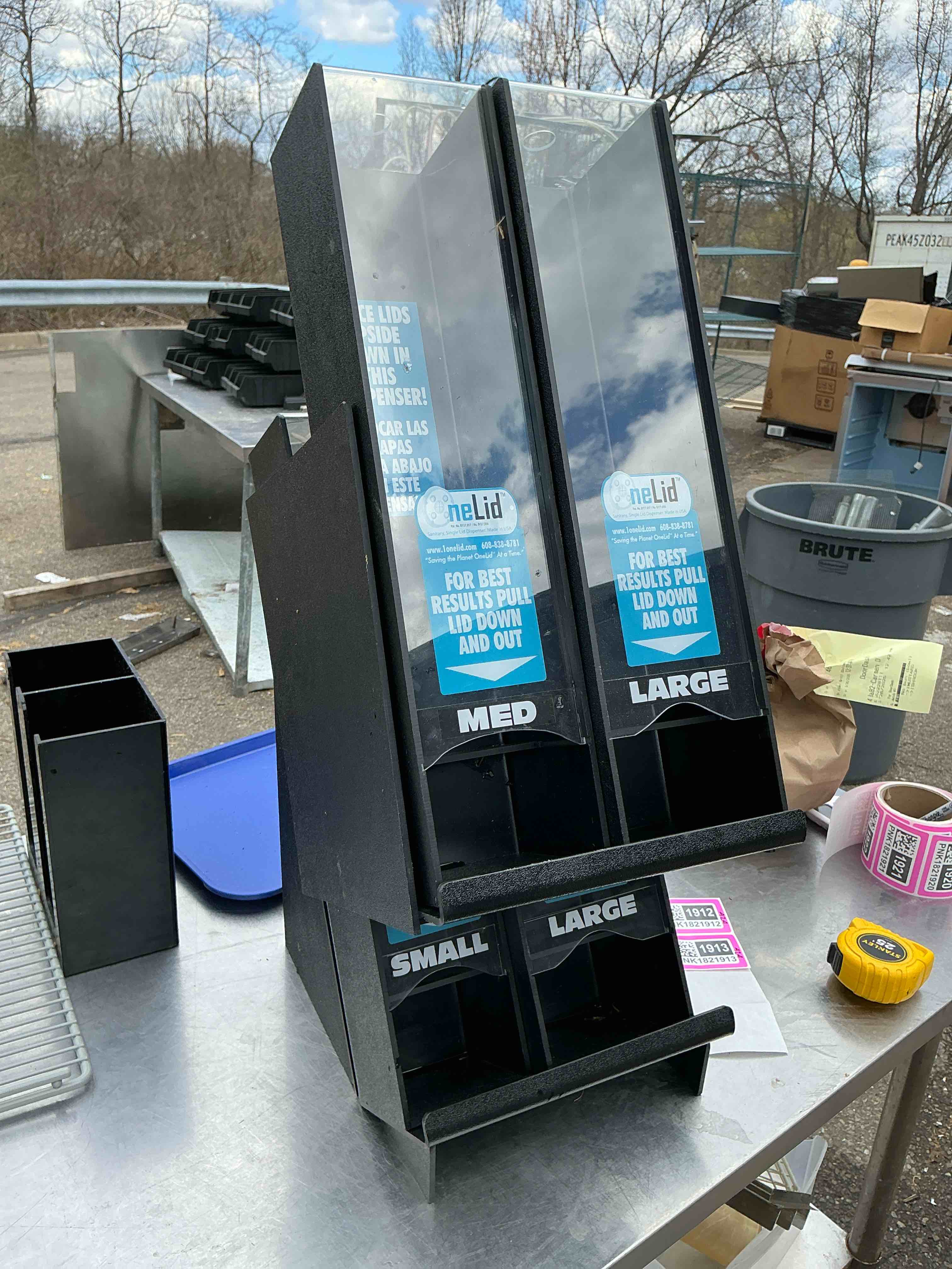 Condition photo showing As Is for 1Onelid lid dispenser 