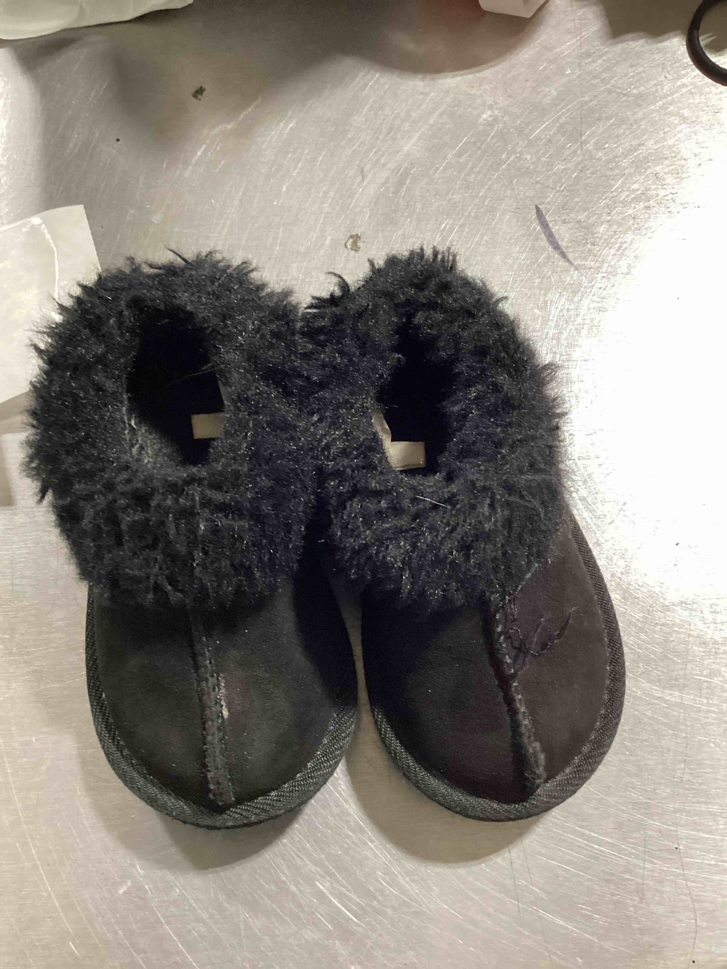 fuzzy slip on black shoes