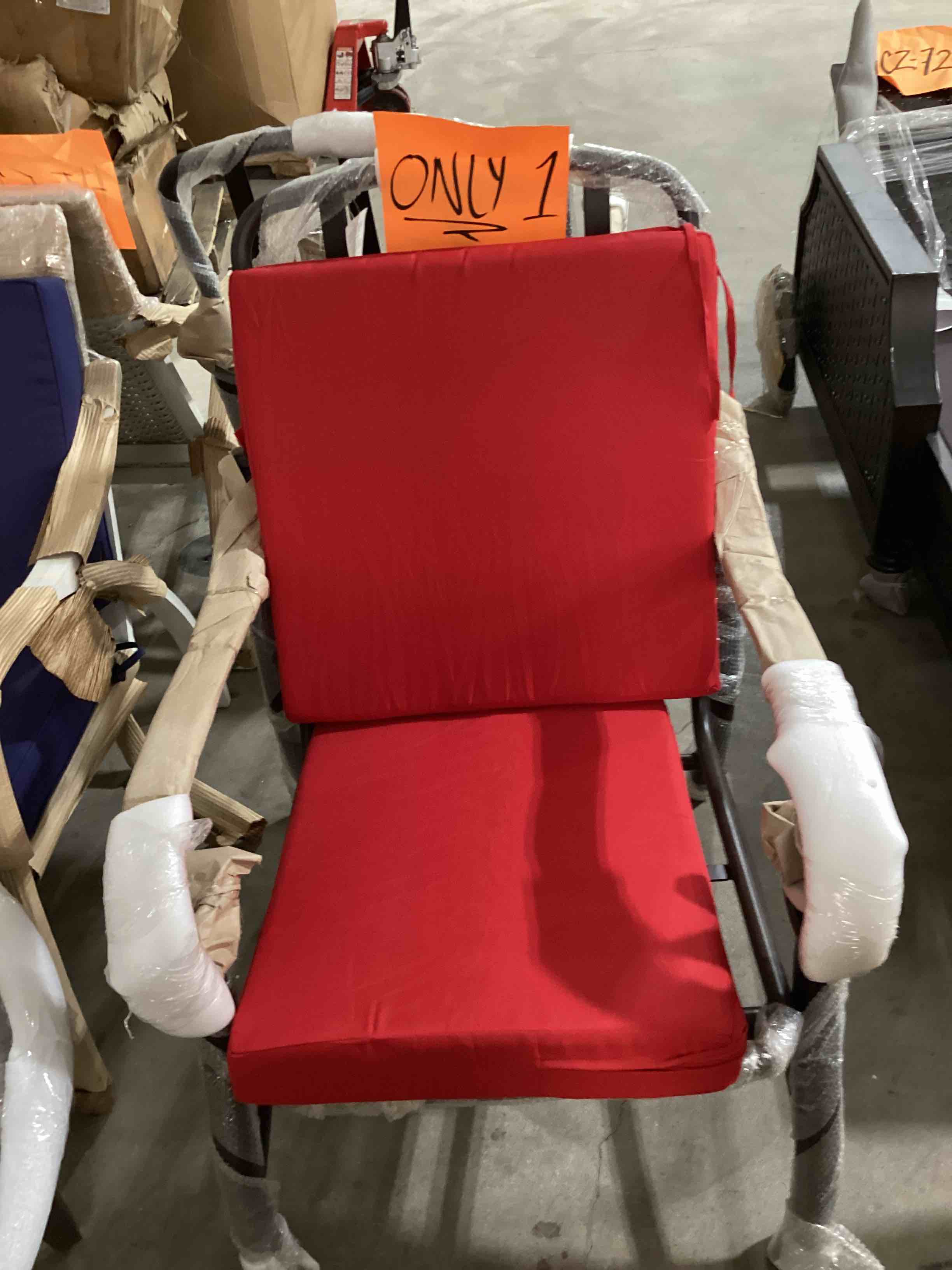 Mallin outdoor chair with red cushions 