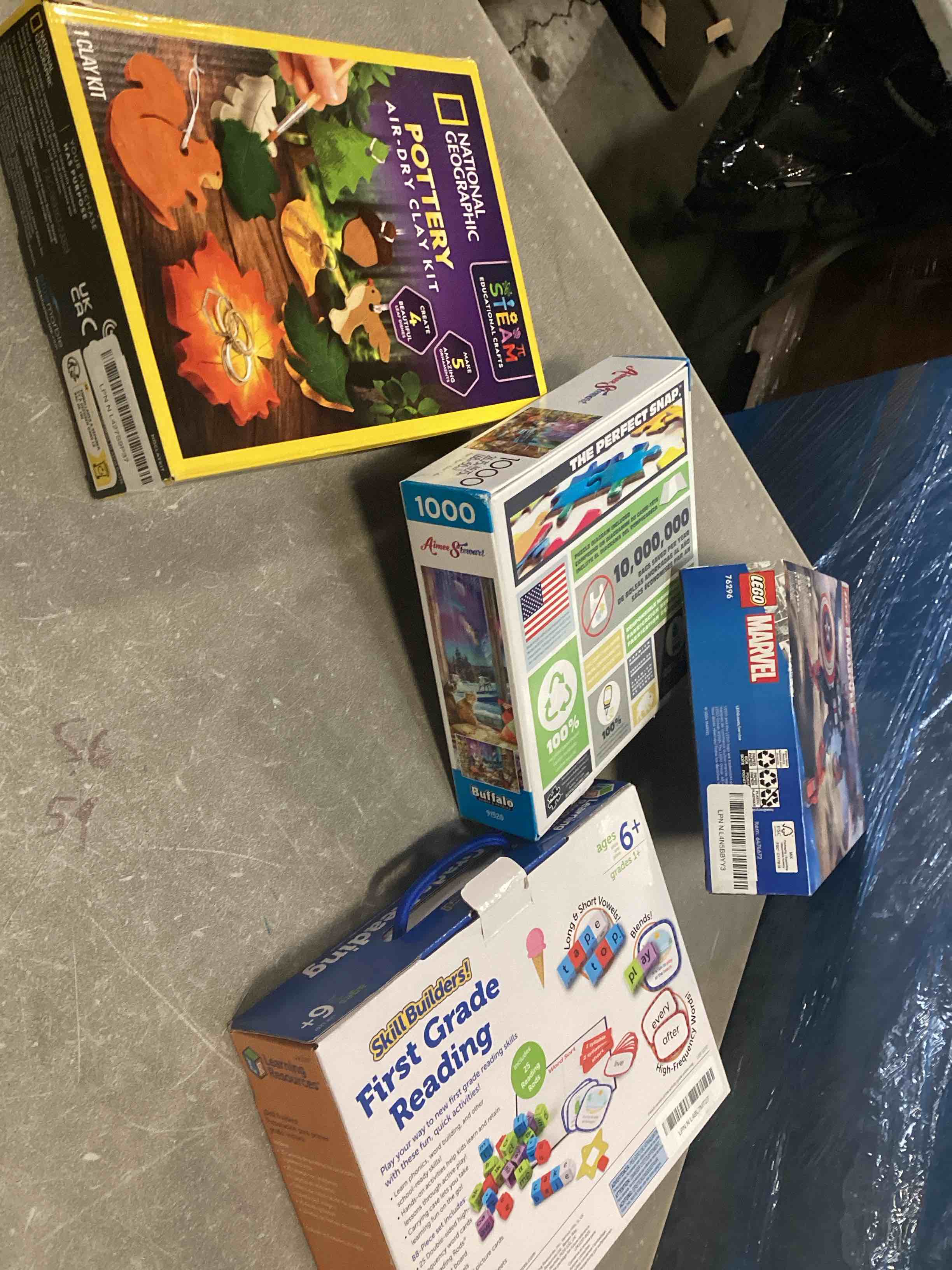 assortment of toys for kids boys and girls of different ages that includes INCOHEARENT, MAIN STREET VILLAGE 1000 piece, CHARLES WYSHOCKI AND MORE