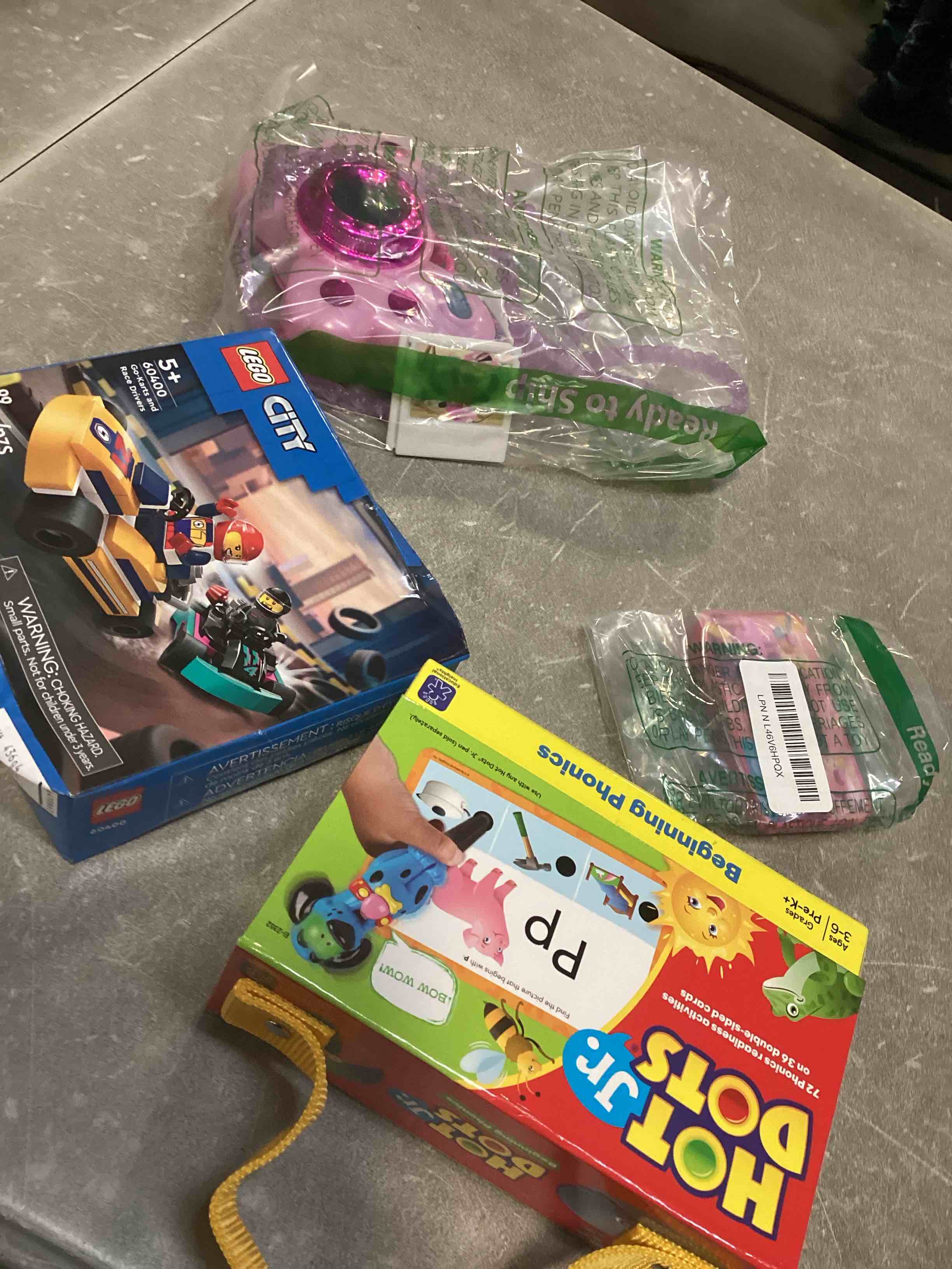  assortment of toys for kids boys and girls  of different ages that includes INCOHEARENT, MAIN STREET VILLAGE 1000 piece, CHARLES WYSHOCKI AND MORE