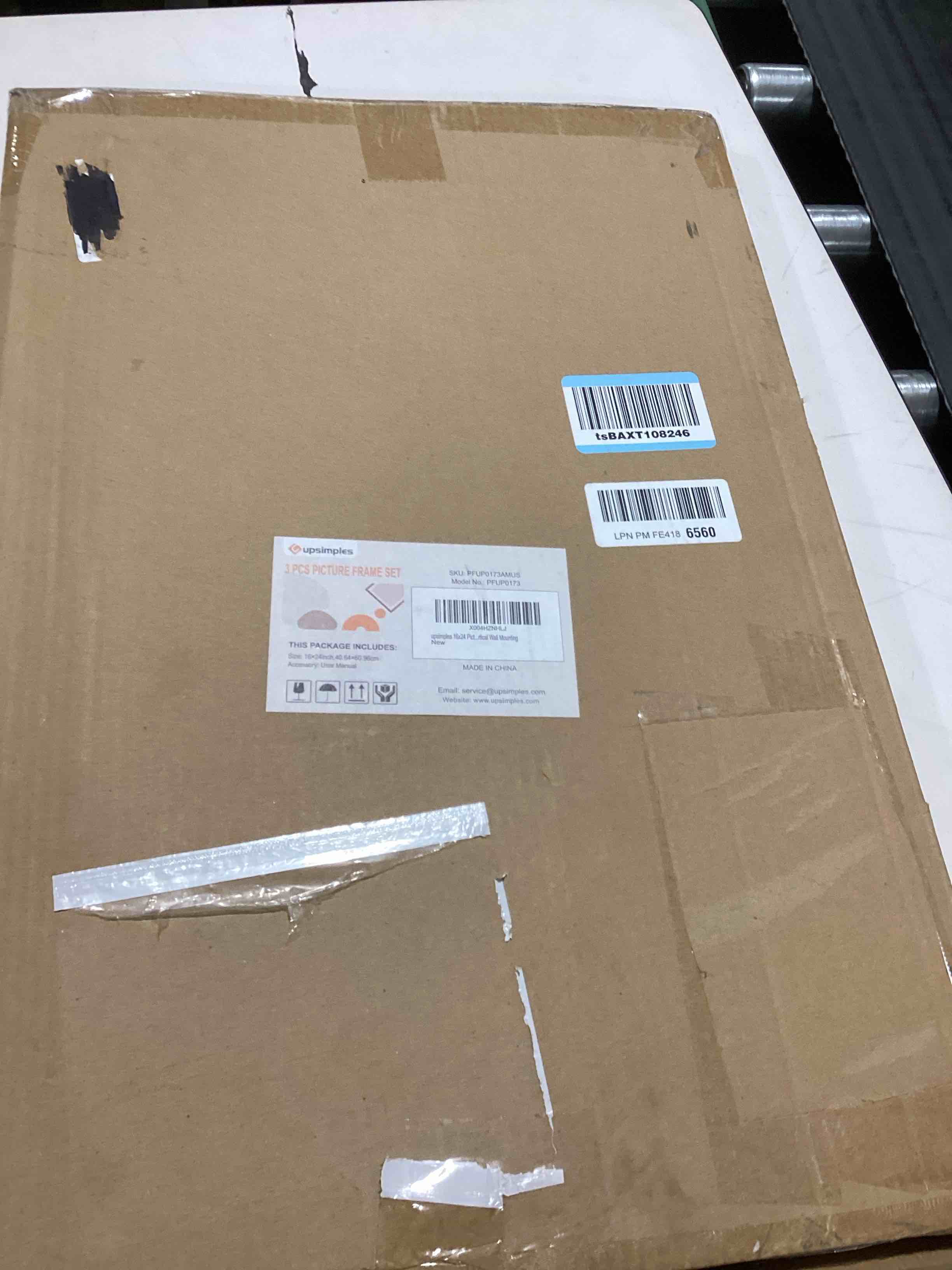 Condition photo showing As Is for upsimples 16x24 Picture Frame Gold 3 Pack, Scratch-Proof Poster Frames 16 x 24 for Photo Gallery - Slide-In Strips, Horizontal or Vertical Wall Mounting Gold 16x24