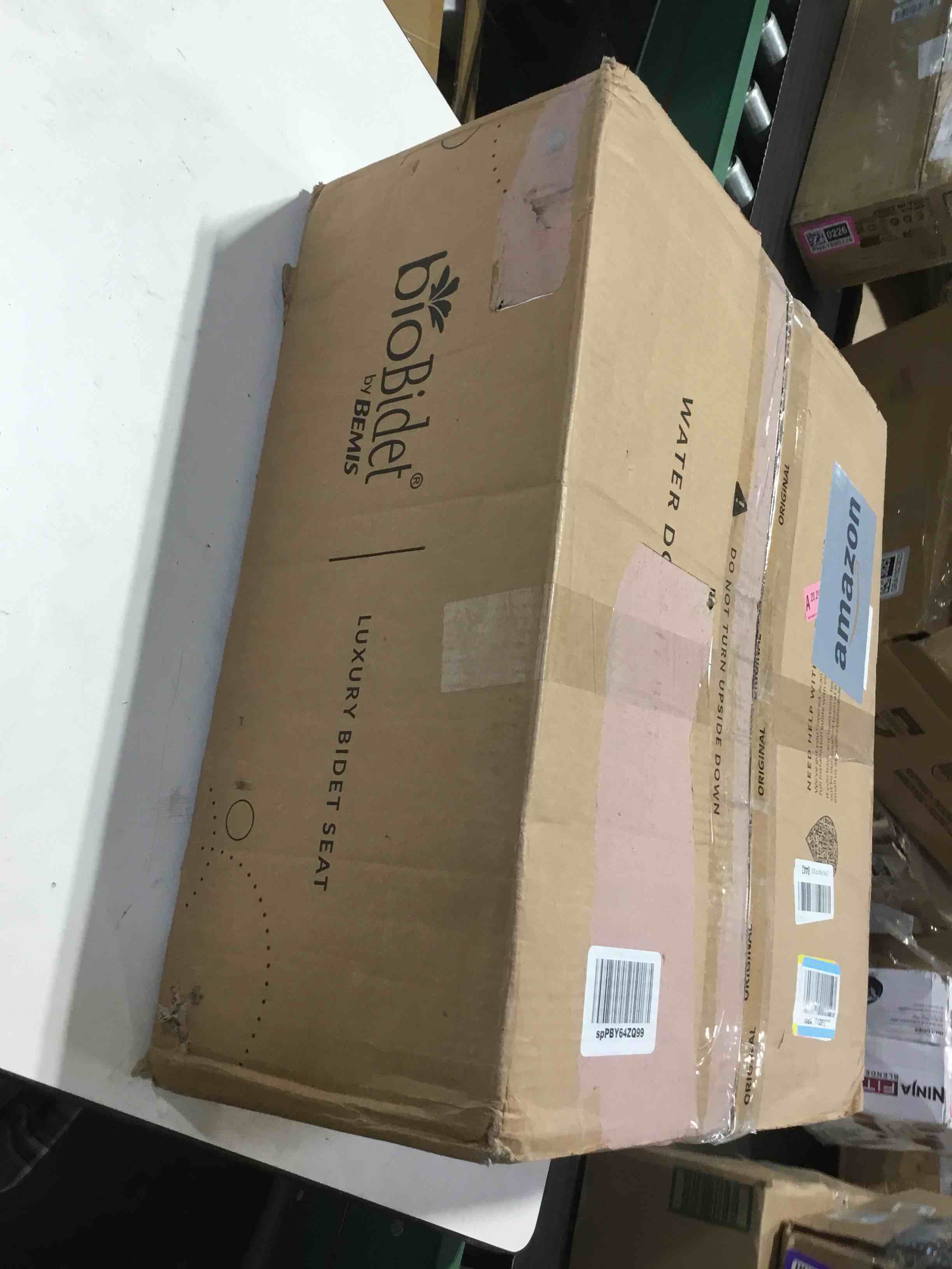 Condition photo showing As Is for Bio Bidet BB1000 Electric Bidet Toilet Seat, Warm Water with Air Dryer, Heated Seat with Slow Close Lid, Remote Control, Elongated White Premium Elongated