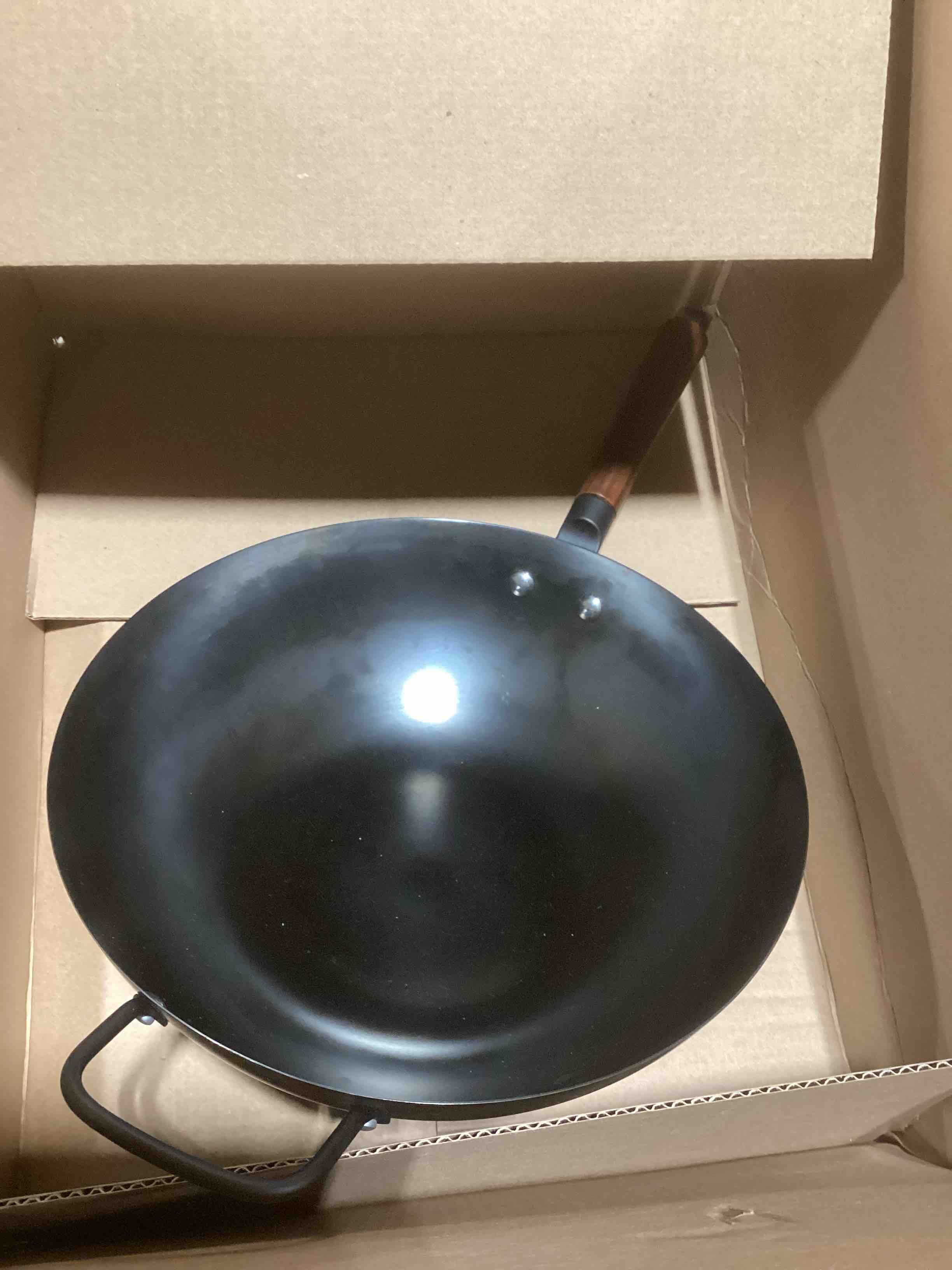 Condition photo showing As Is for Amazon Basics Carbon Steel Pre-Seasoned Wok with Acacia Wood Handle, All Cooktop Friendly, 12.6 in.
