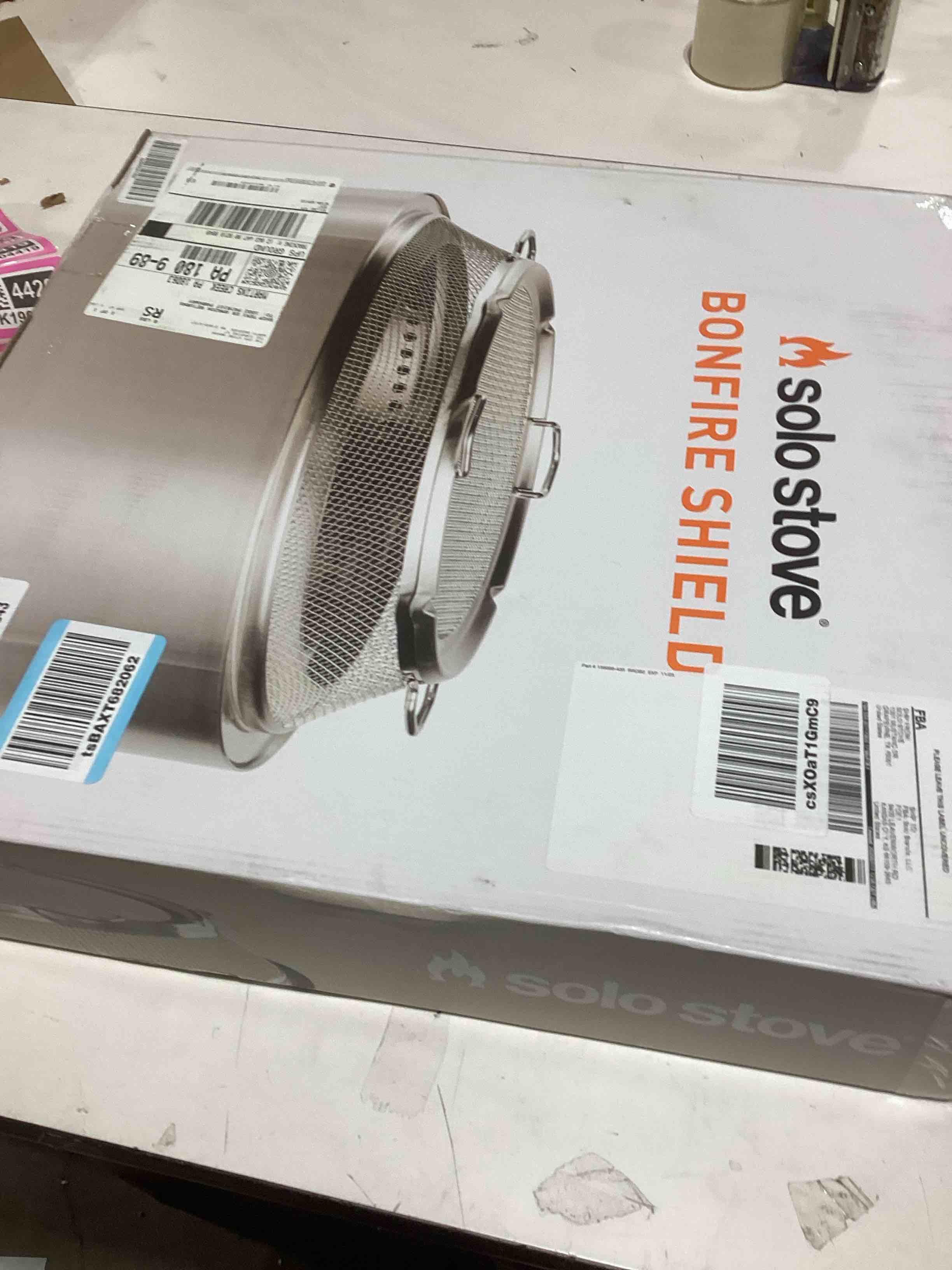 Condition photo showing As Is for Solo Stove Bonfire Shield - Durable Stainless Steel Spark Protector Mesh Screen for Fire Pits, Keeps Pops and Hot Embers Contained for Safe Outdoor Fires, Includes Shield Removal Tools