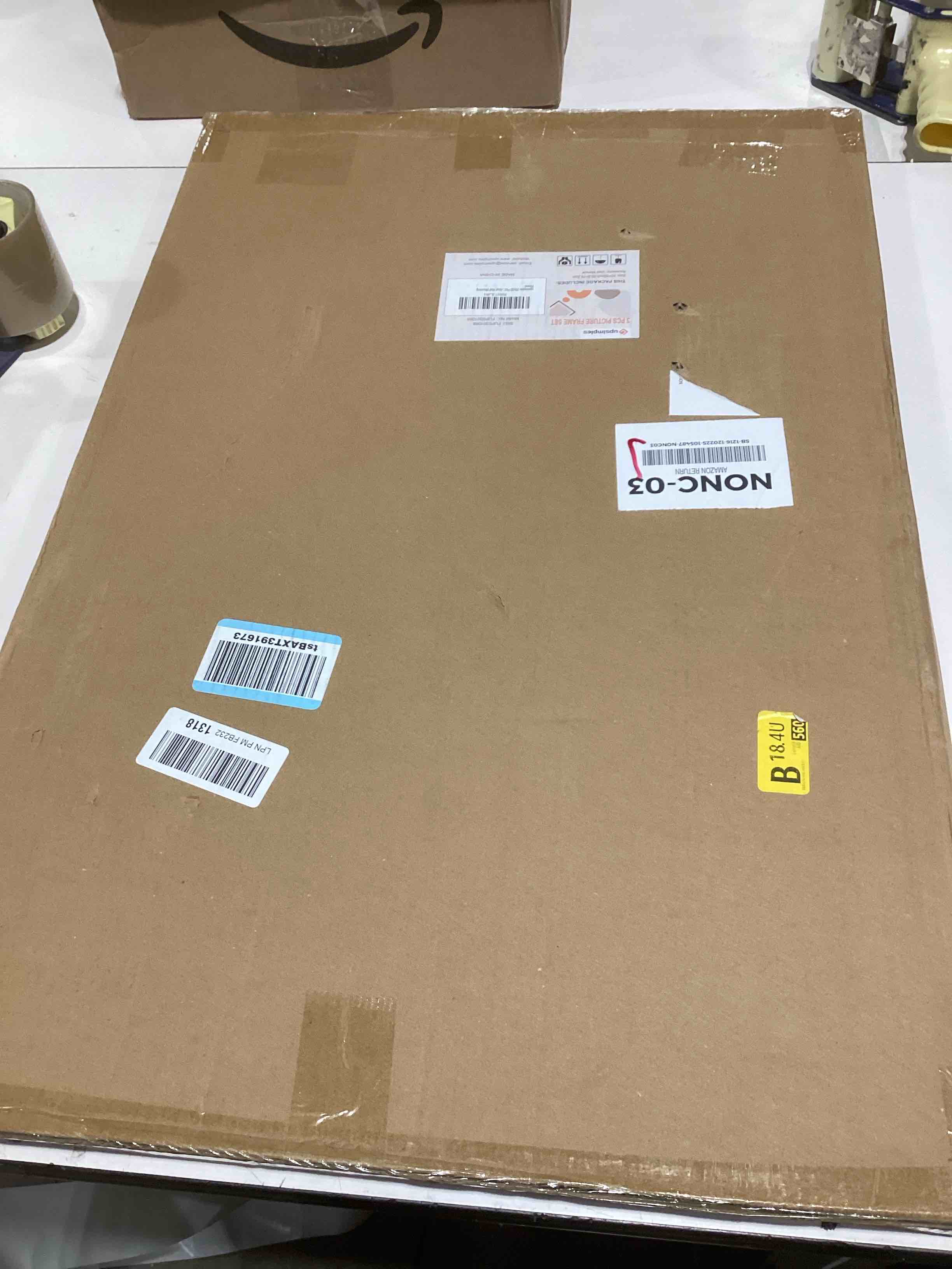 Condition photo showing As Is for upsimples 20x30 Picture Frame Black 3 Pack, Scratch-Proof Poster Frames 20 x 30 for Photo Gallery - Slide-In Strips, Horizontal or Vertical Wall Mounting Black 20x30