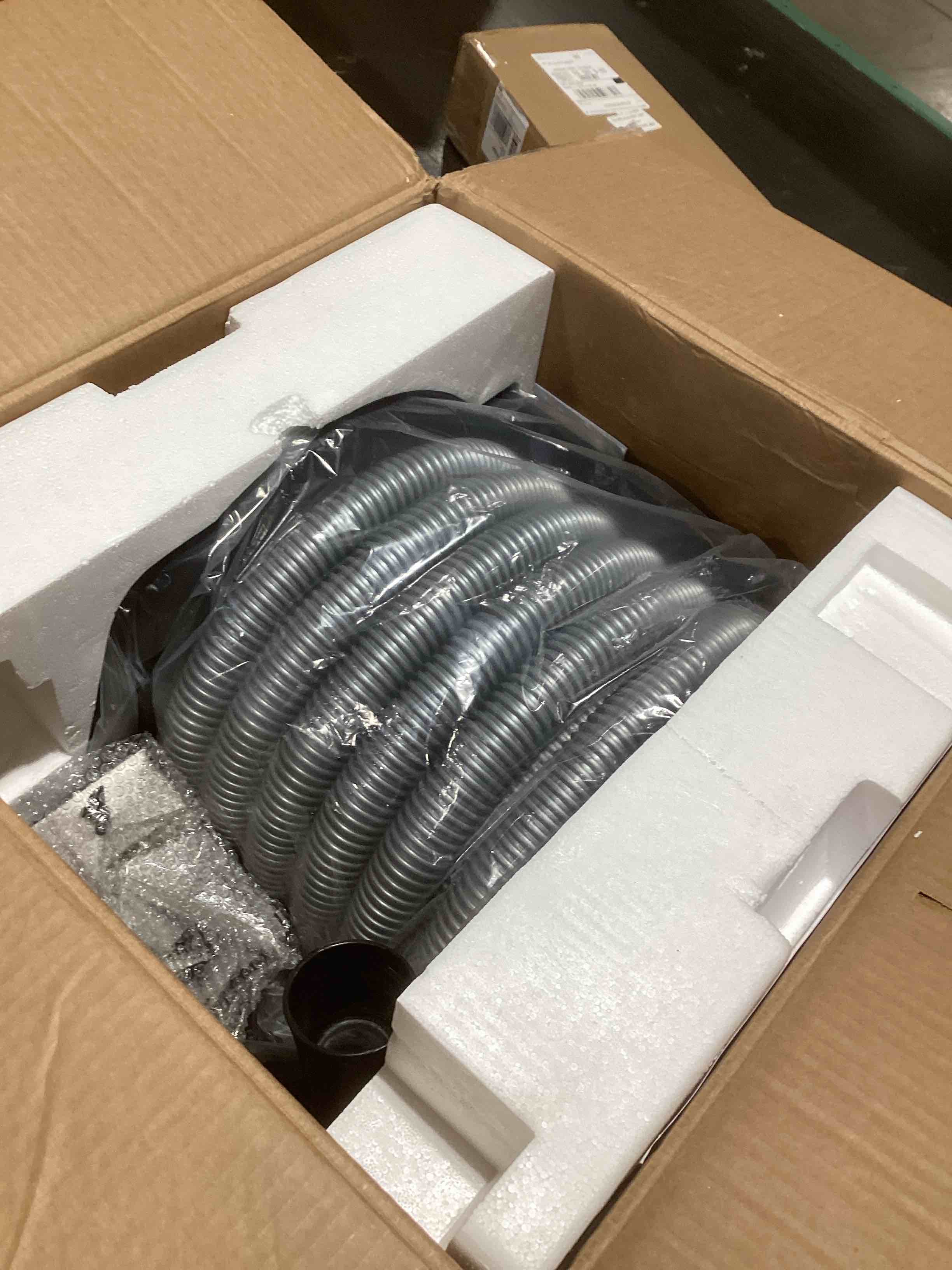 Condition photo showing As Is for vacuum cleaner hose winder 