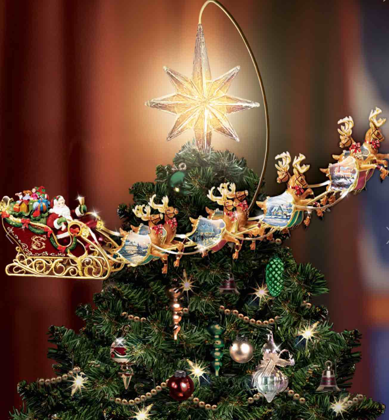 The Thomas Kinkade Revolving Christmas Tree Topper