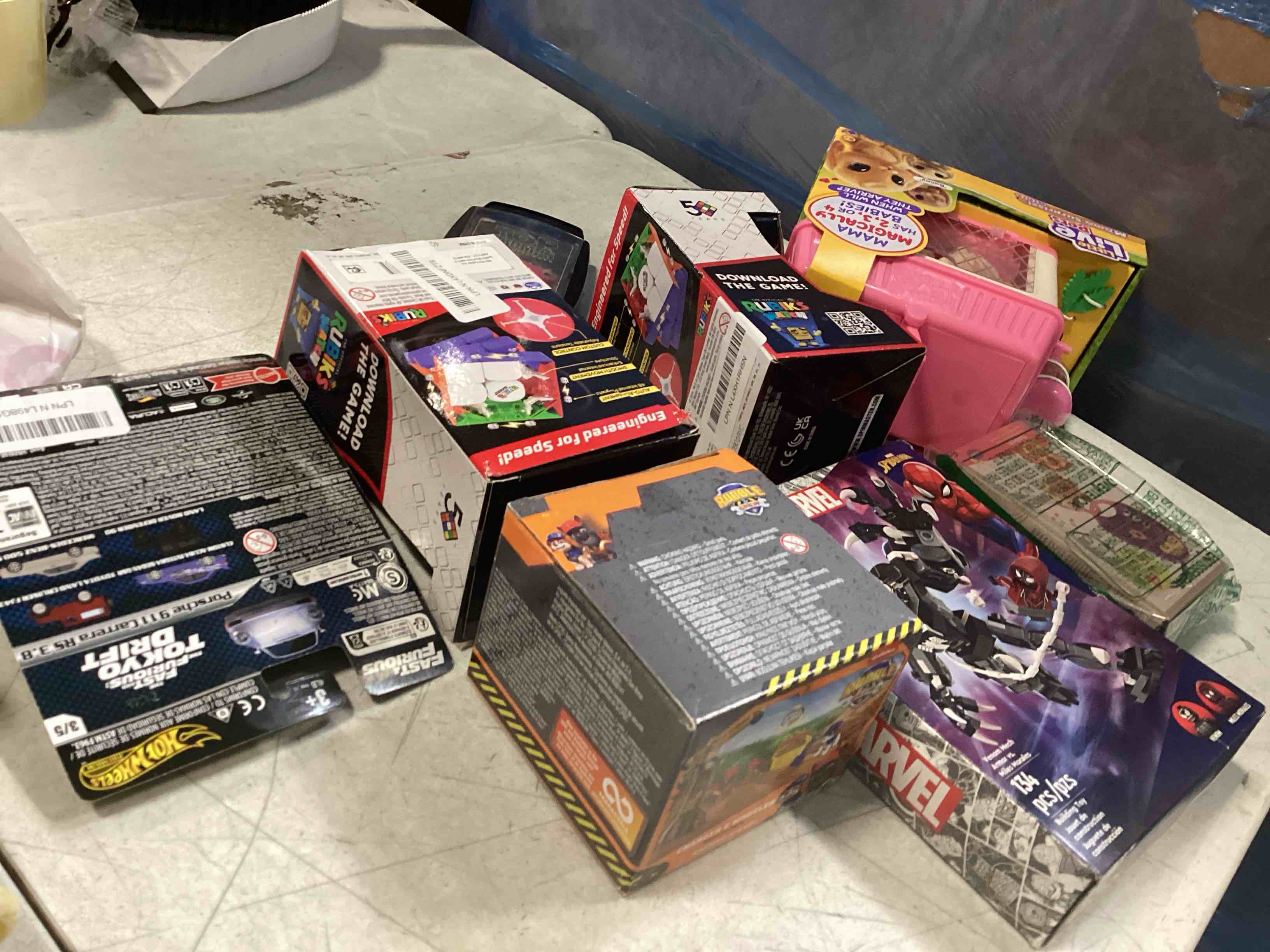  assortment of toys for kids boys and girls  of different ages that includes INCOHEARENT, MAIN STREET VILLAGE 1000 piece, CHARLES WYSHOCKI AND MORE