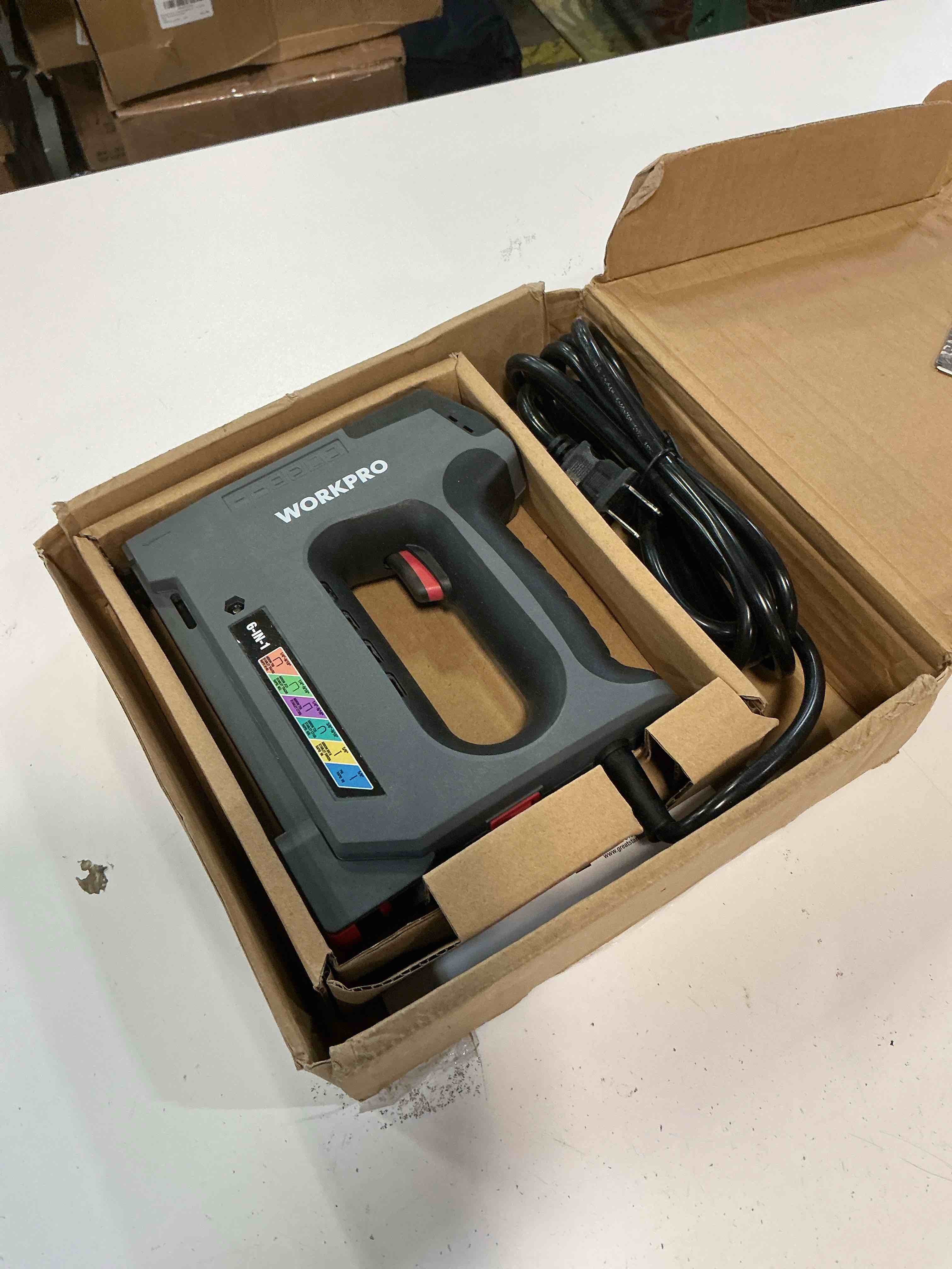 Condition photo showing As Is for WORKPRO 6 in 1 Staple Gun,110V Corded Brad Nailer with 2000 Staples and Nails, Electric Staple Gun for DIY Project of Woodworking